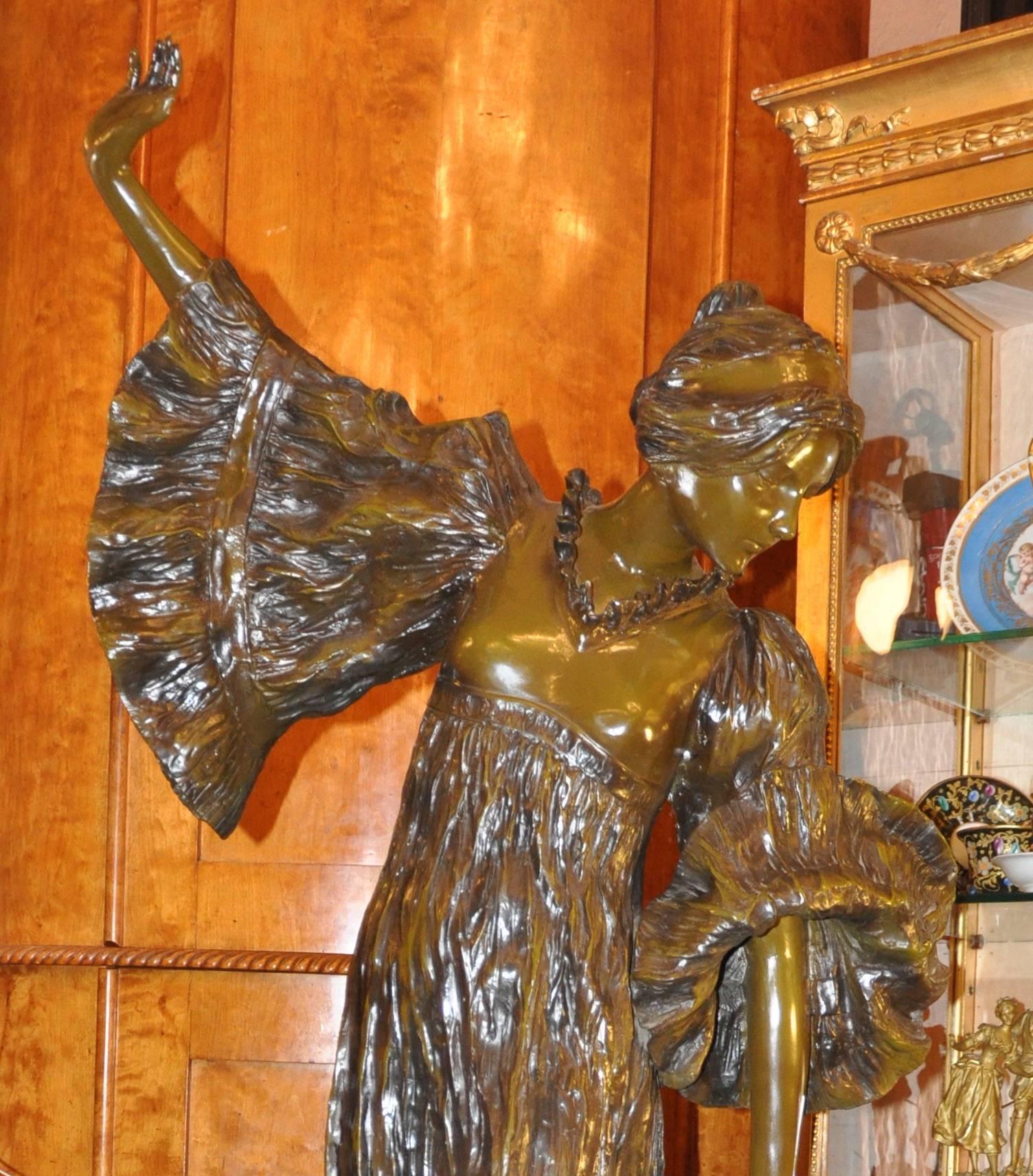 Important Art Nouveau sculpture in cast bronze lost-wax coated in green and depicting maiden. Signed 