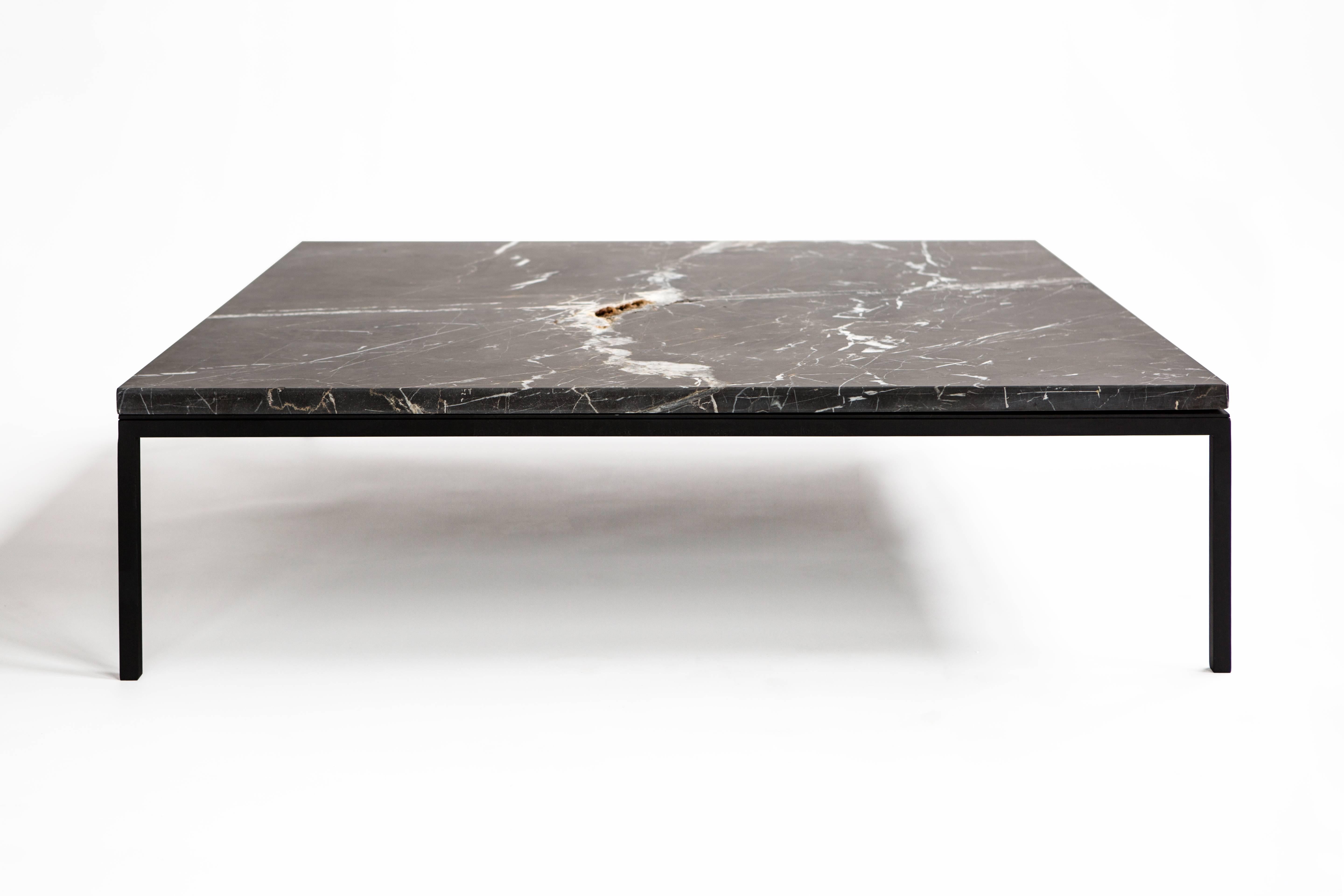 This unique coffee table is a part of the Found collection of one-of-a-kind functional art pieces. This Minimalist and elegant piece is a combination of organic and geometric. It features a single slab of black marble that was hand-picked at a