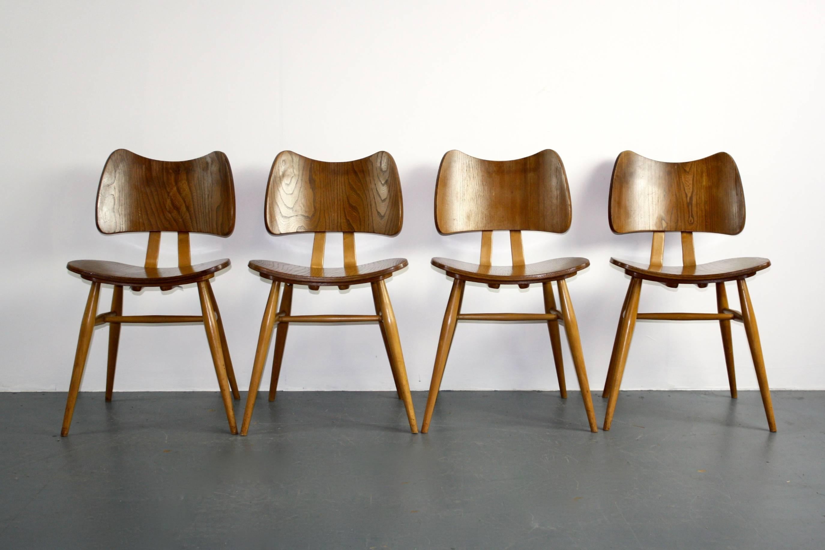 Gorgeous set of four vintage Ercol butterfly chairs made of elm with slender turned legs. 

In good vintage condition; some signs of wear and tear, commensurate with age, but nothing major. 

Approx dimensions:

Height 76 cm.

Width 43