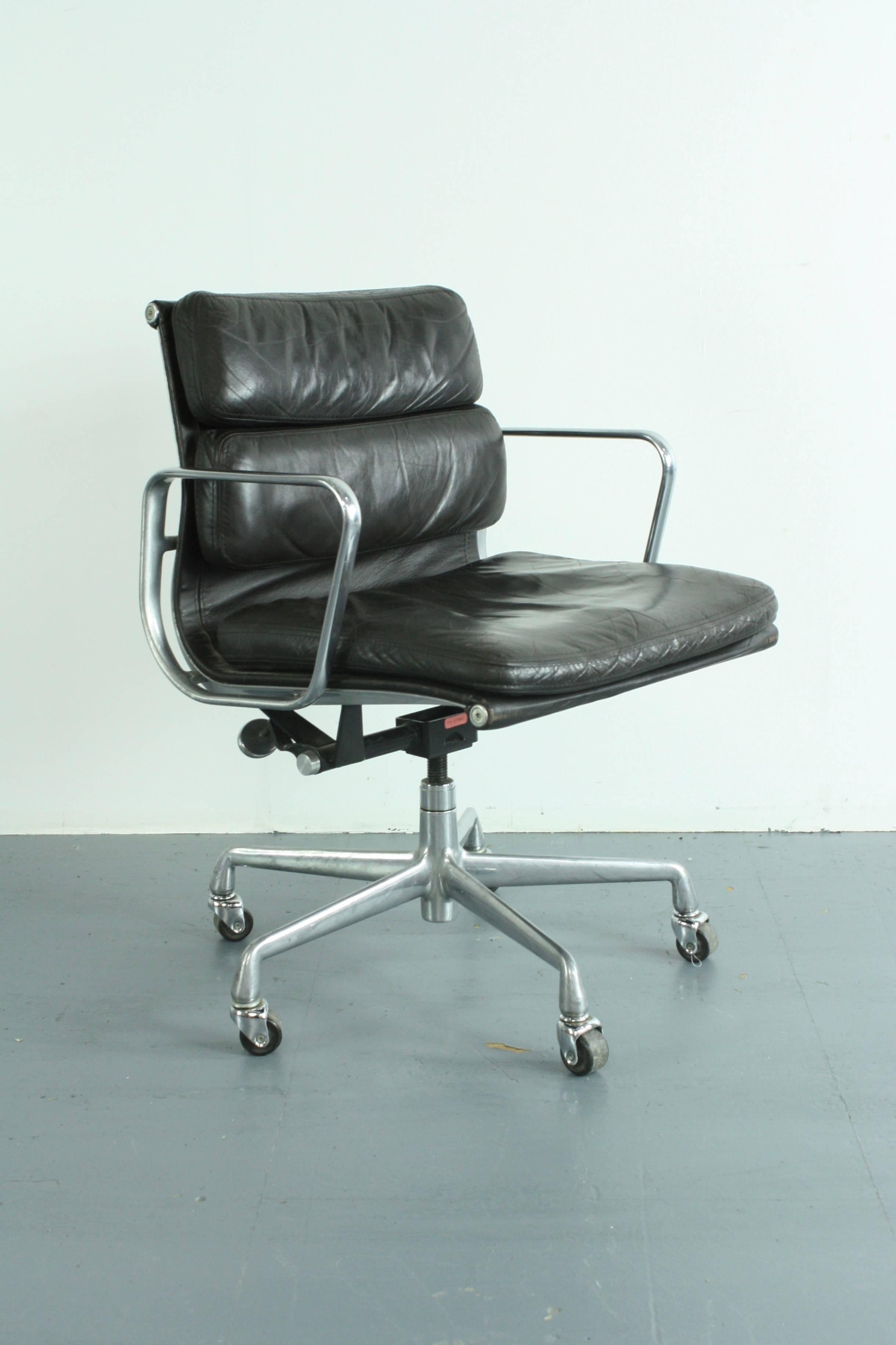 Beautiful vintage dark chocolate brown leather soft pad aluminium group chair designed by Charles and Ray Eames for Herman Miller in the 1960s. This one was made in the early 1980s. This is a limited edition executive edition with full leather back