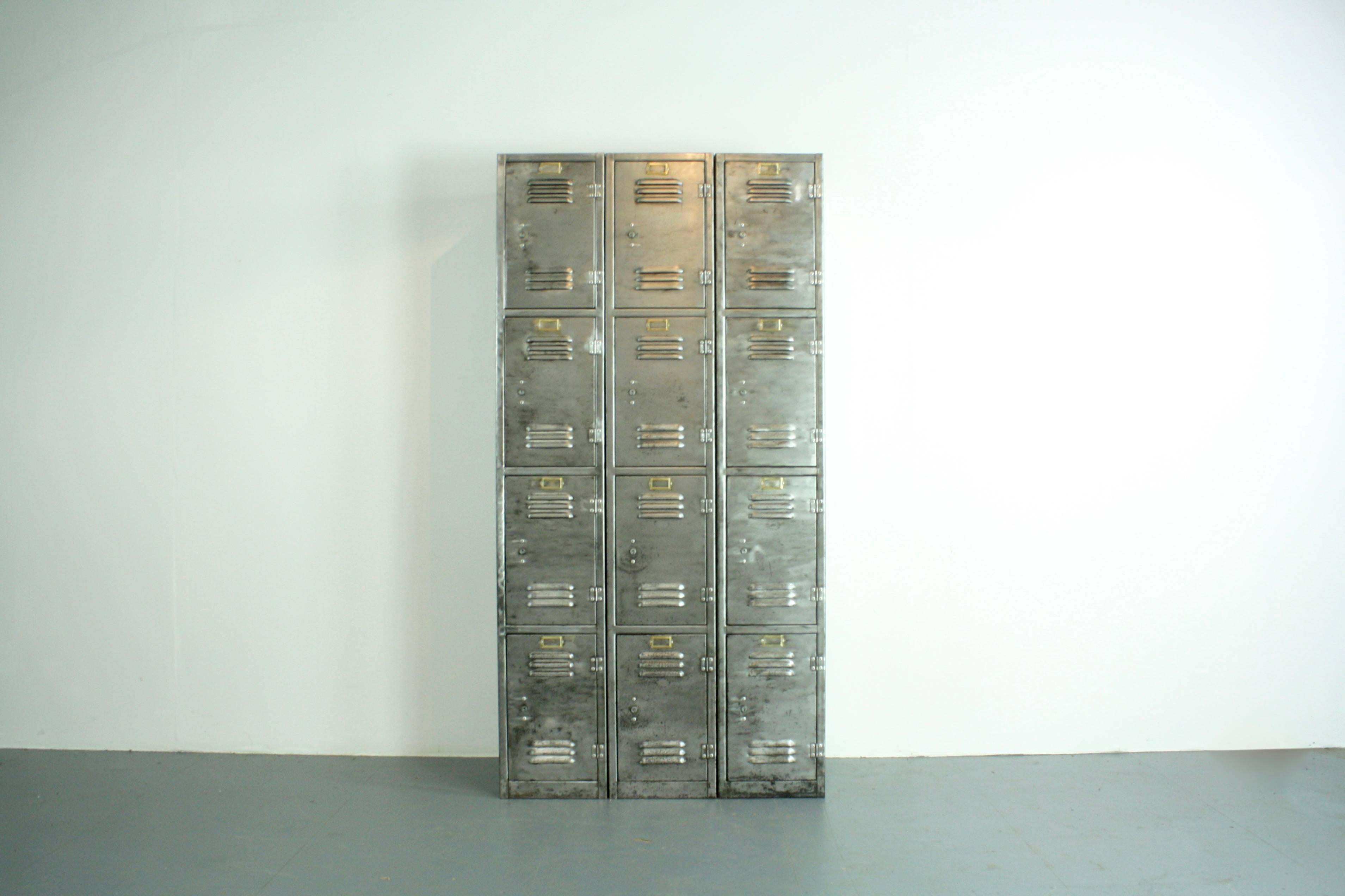 Vintage stripped and polished steel school locker with 12 compartments.

The insides retain the original painted finish. They have working locks but no keys currently, although they could be cut if wanted.

Please note that, due to its age and