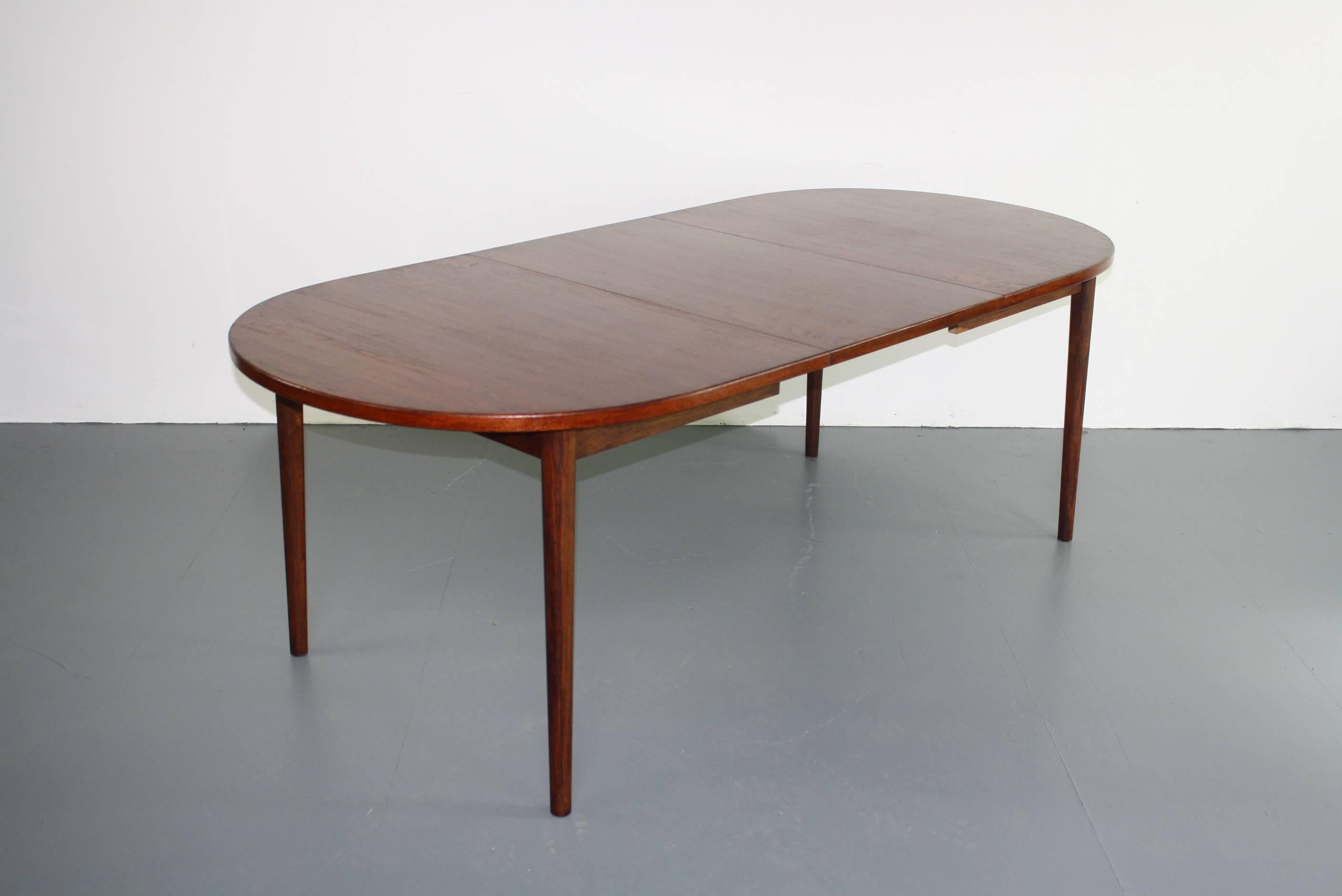 Really lovely 1960s-1970s extending teak dining table designed by Nils Jonsson for Troeds of Sweden. The table has two removable leaves that can be stored directly underneath, meaning that it can be three lengths, seating a maximum of ten