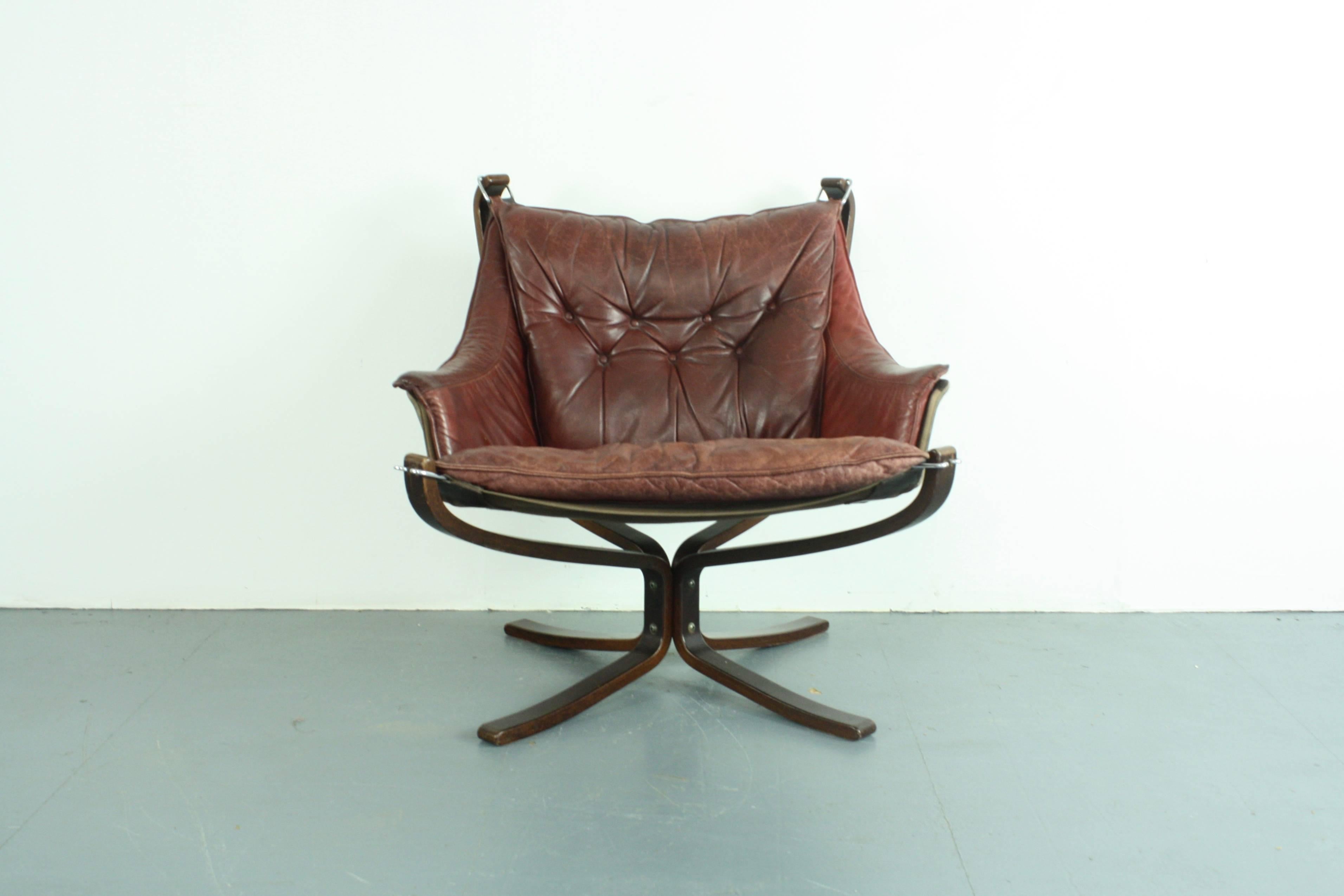 Norwegian Low Back Winged Chestnut Brown Leather Falcon Chair Designed by Sigurd Resell For Sale