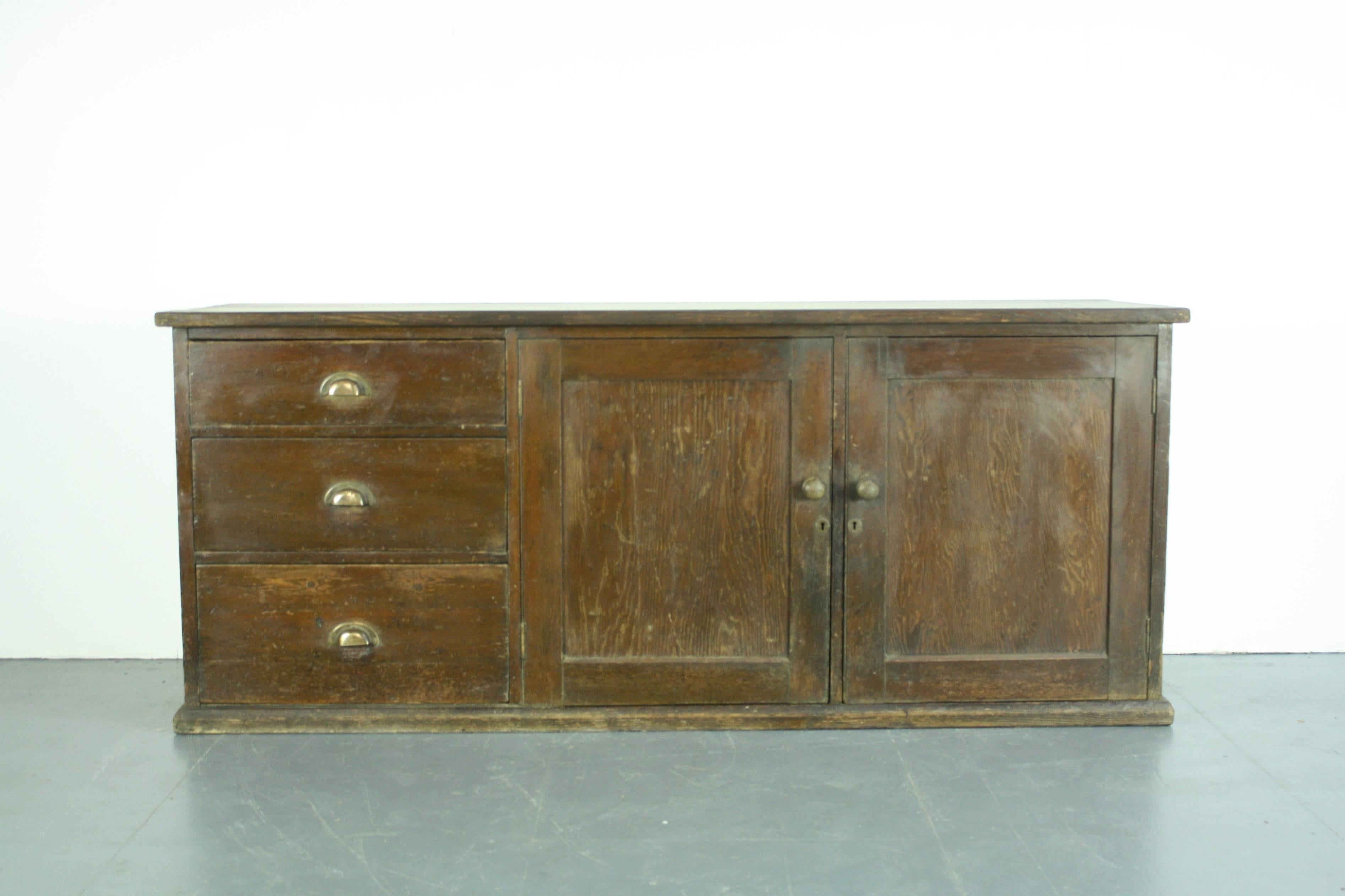 Wonderful dark wood counter from the beginning of the last century. Lovely solid piece.

In good vintage condition. Some wear and tear to be expected with age, but nothing which detracts. If you bear in mind this item has come from a working shop,