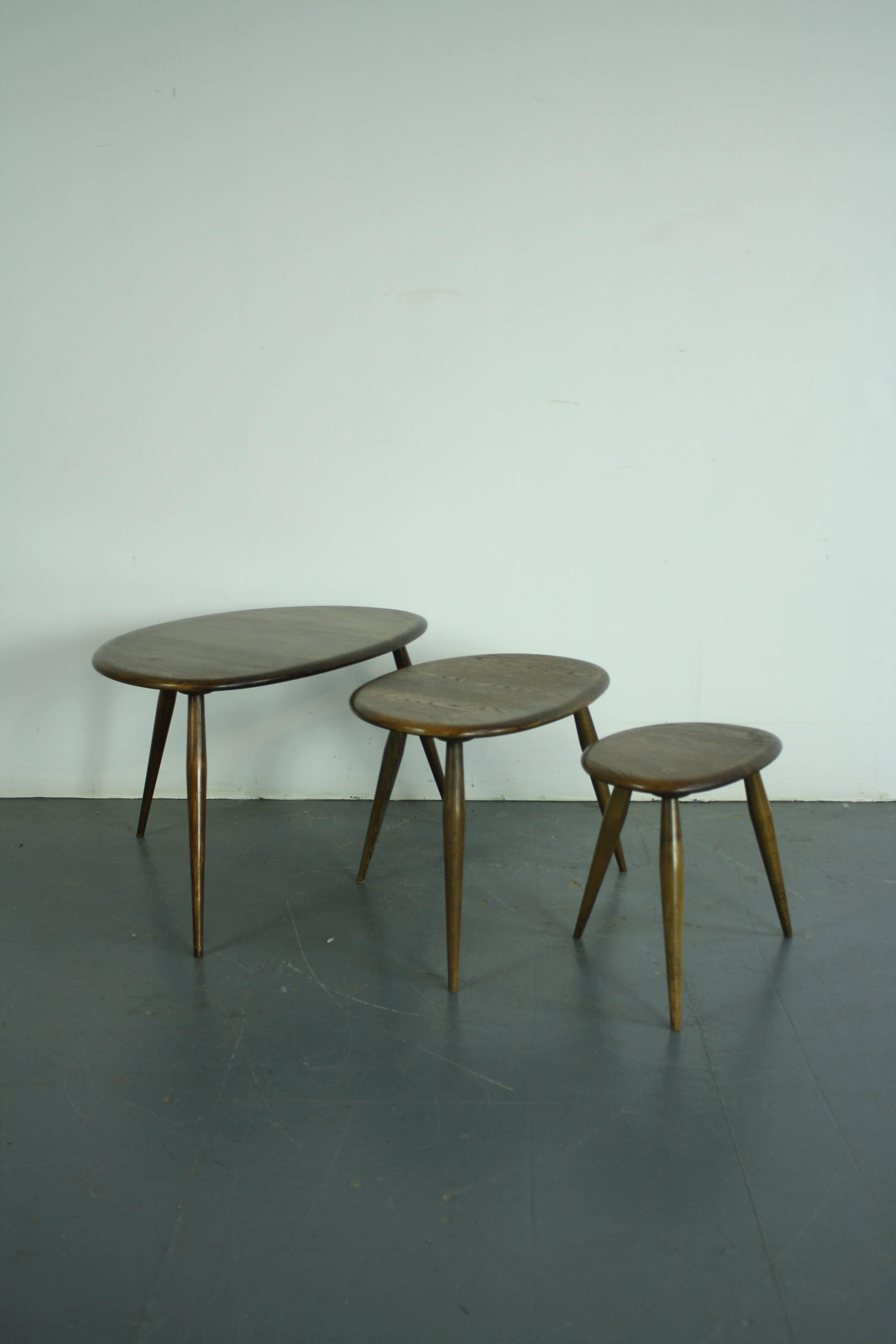 Designed by Lucian Ercolani 1956, these Ercol tables have a wonderful simplicity of design and appealing curves. Made with a beech top and splayed tapering legs. Lovely patina to the wood.

In good vintage condition, with some wear commensurate