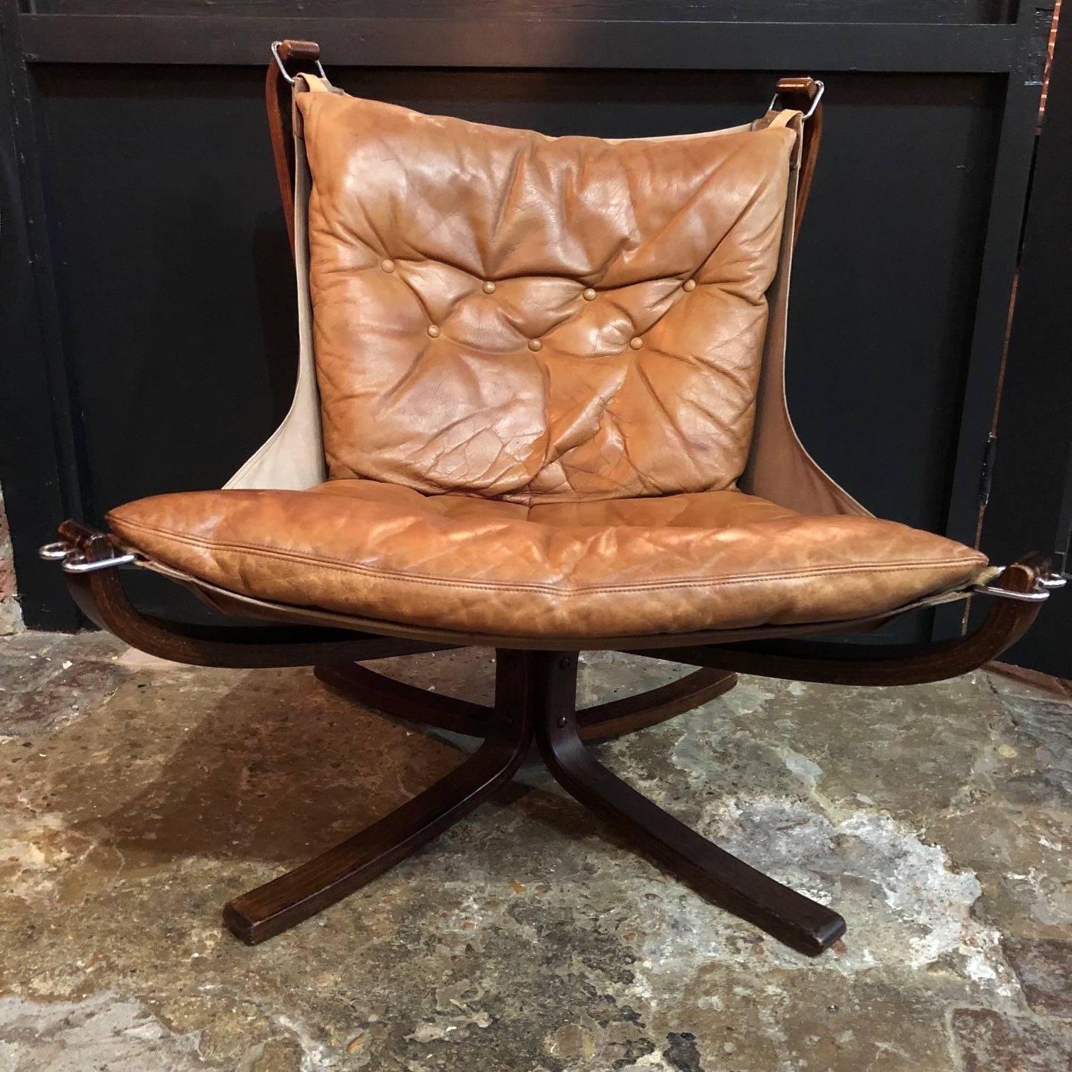 Low back camel brown vintage leather Falcon chair designed by Sigurd Resell. 

In very good vintage condition. There is some age-related wear, as expected, but nothing really noticeable, and nothing specific to mention. The leather is in very good