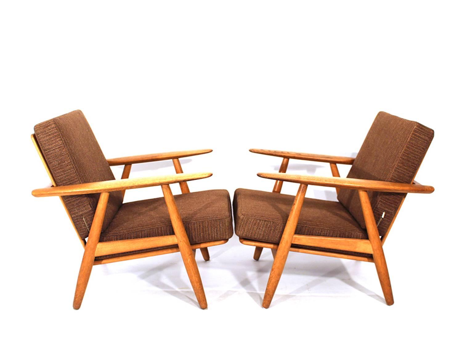 Cigar chairs, model GE240.
Design Hans J Wegner 1955.
Made by GETAMA, Denmark.
Oak, original fabric.
  