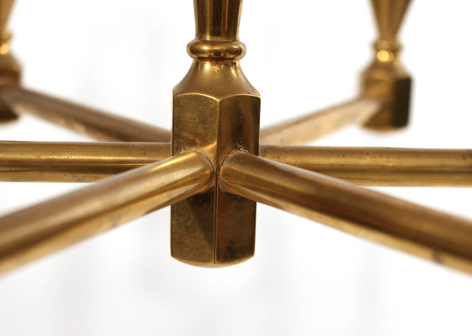 Rare chandelier with nine arms.
Made Gusum Metallslöjd 1978, Sweden.
Solid brass. The brass chain is 100 cm.