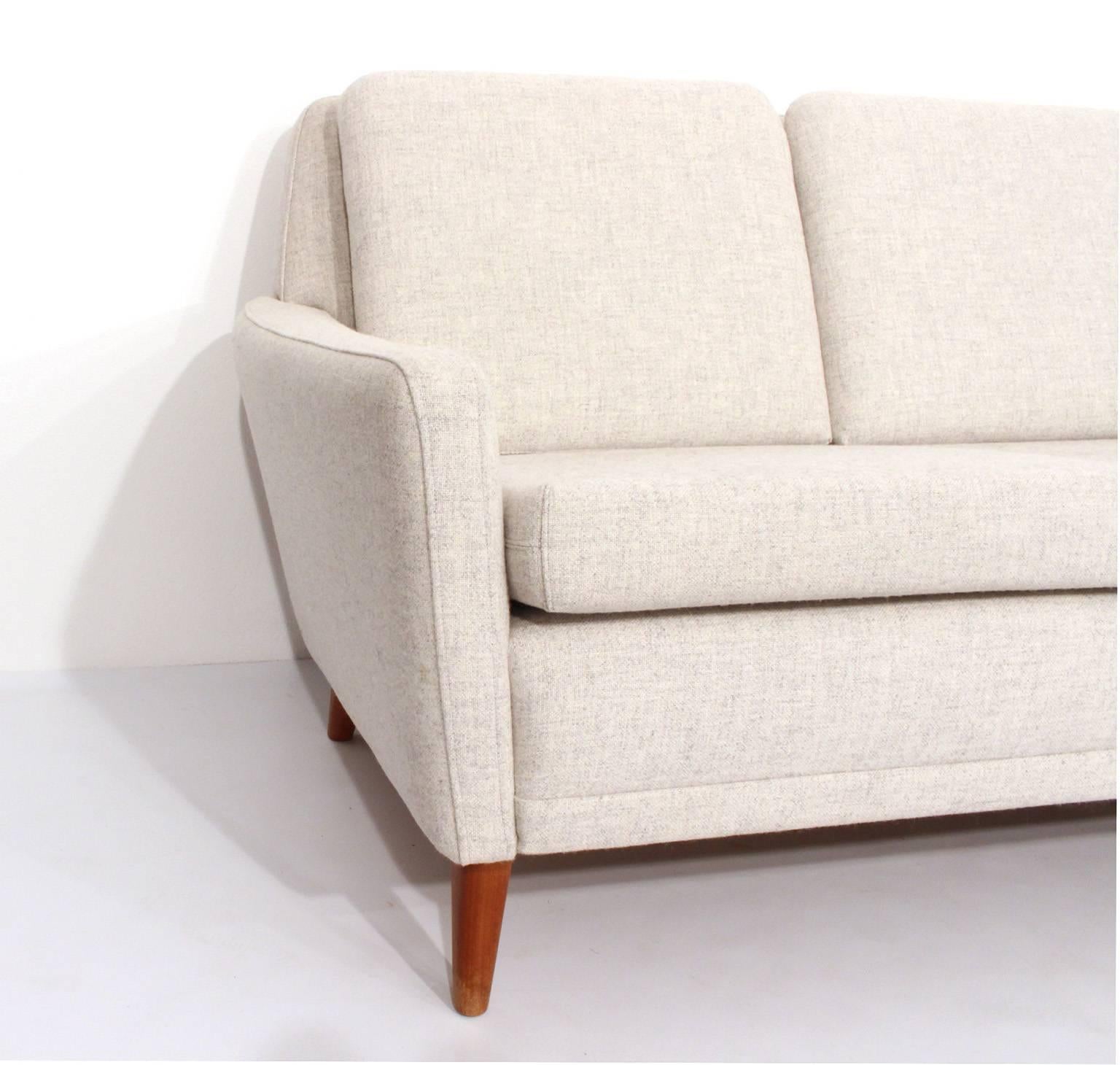 Midcentury four-set sofa, design Folke Ohlsson for DUX, Sweden.

Completely restored and reupholstered in Kvadrat fabric in 2014.