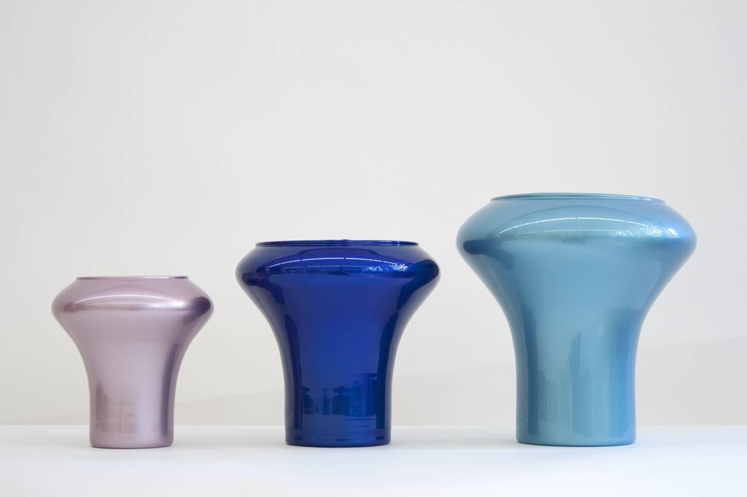 Ragaz
Set of three glass vases handblown and lacquered with car paint.
Each vase is lacquered bicolor and signed and numbered (of an edition of eight) by Philippe Cramer.

Small vase exterior pink/interior yellow.
Dimensions: Ø 16 cm x height 16 cm,