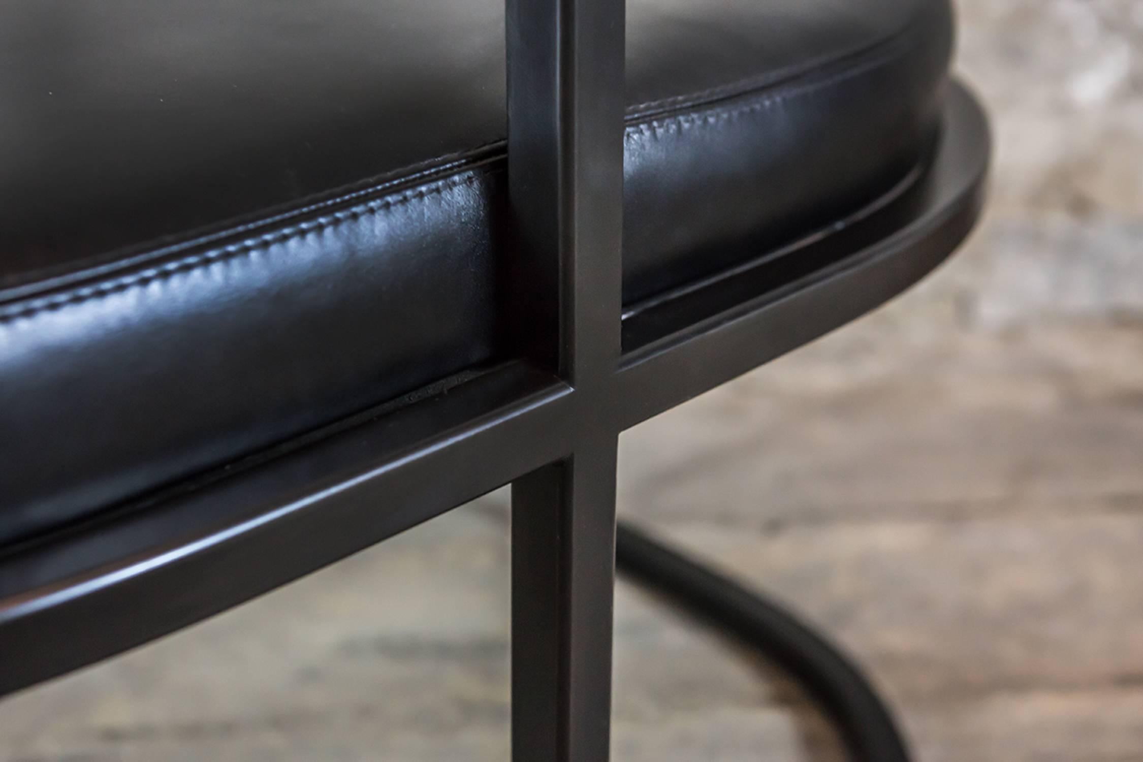 Kingston chair. Black lacquered steel with black leather seat.