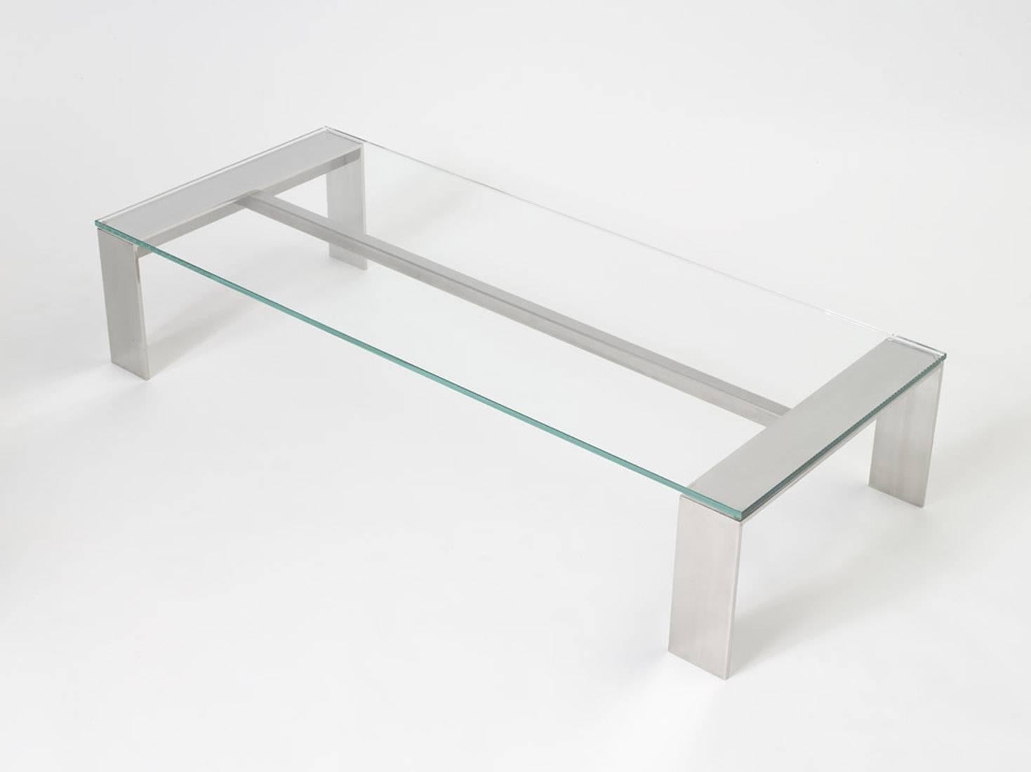 Bridge coffee table.
Stainless steel with mirror polished and brush finish. Clear glass. Minimal, clean finish makes for a very elegant design.