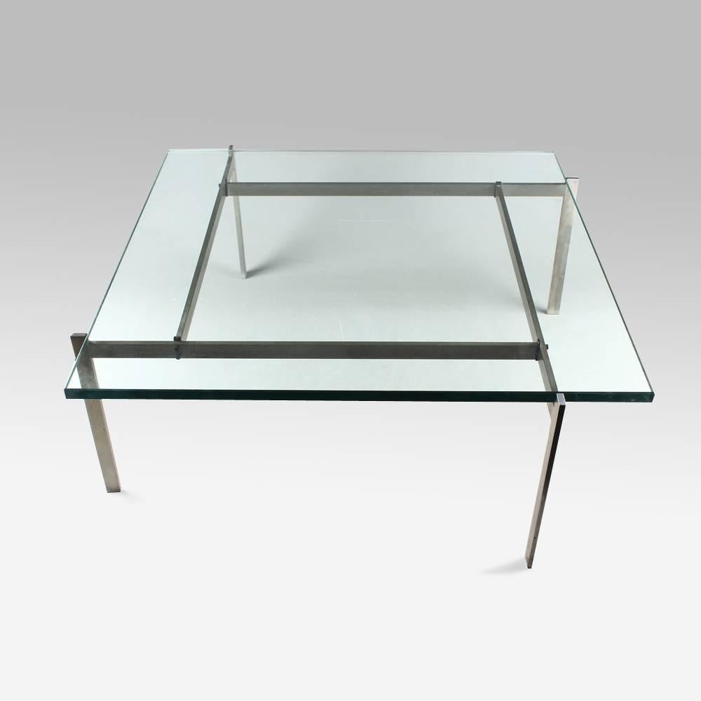 A square coffee table with a slate top on a four legs matte chrome-plated steel stand, 
Denmark.
Model created in 1956.
First edition stamped by maker E. Kold Christensen.
 