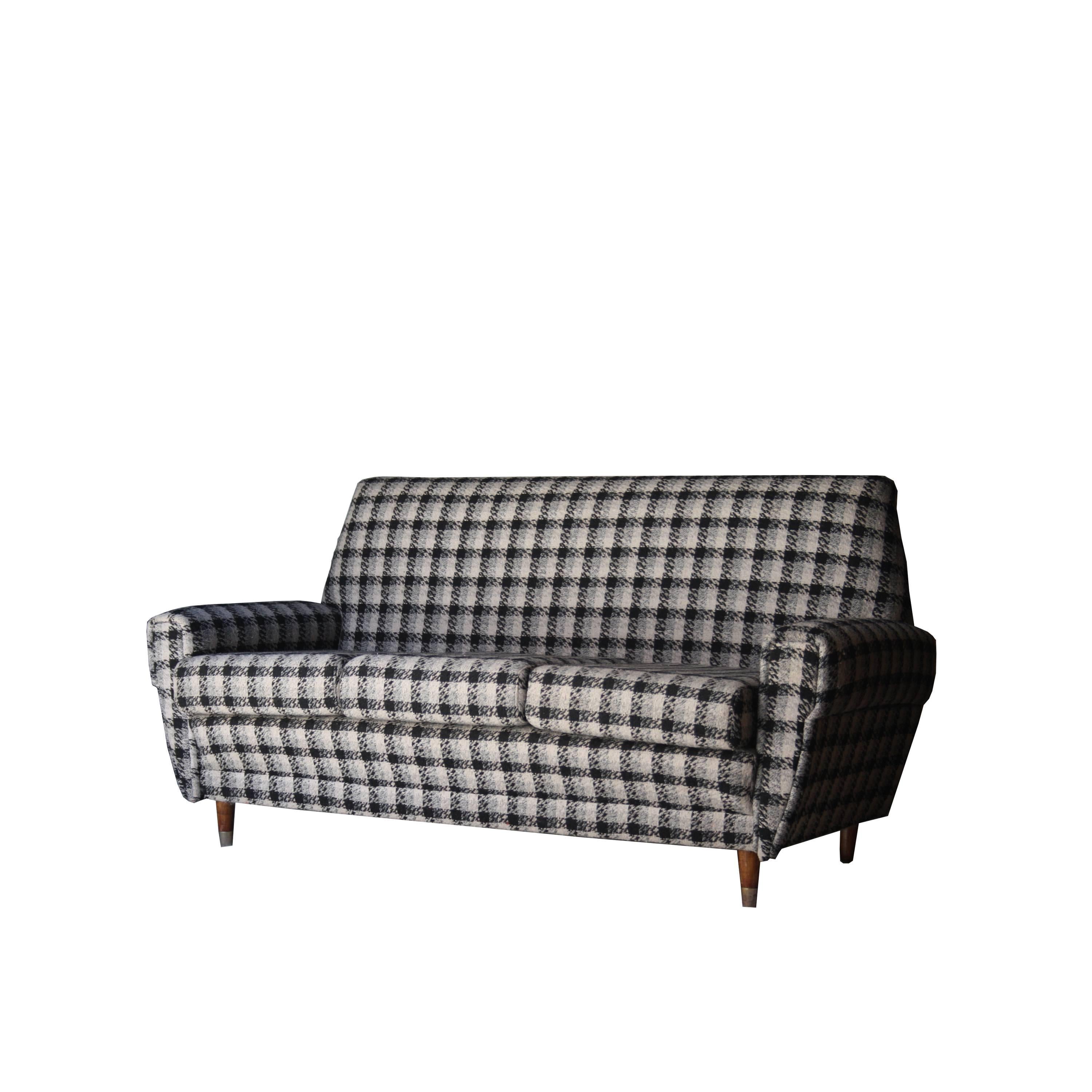 Three-seat sofa with structure in solid wood upholstered in cold wool type tweed with frame print.