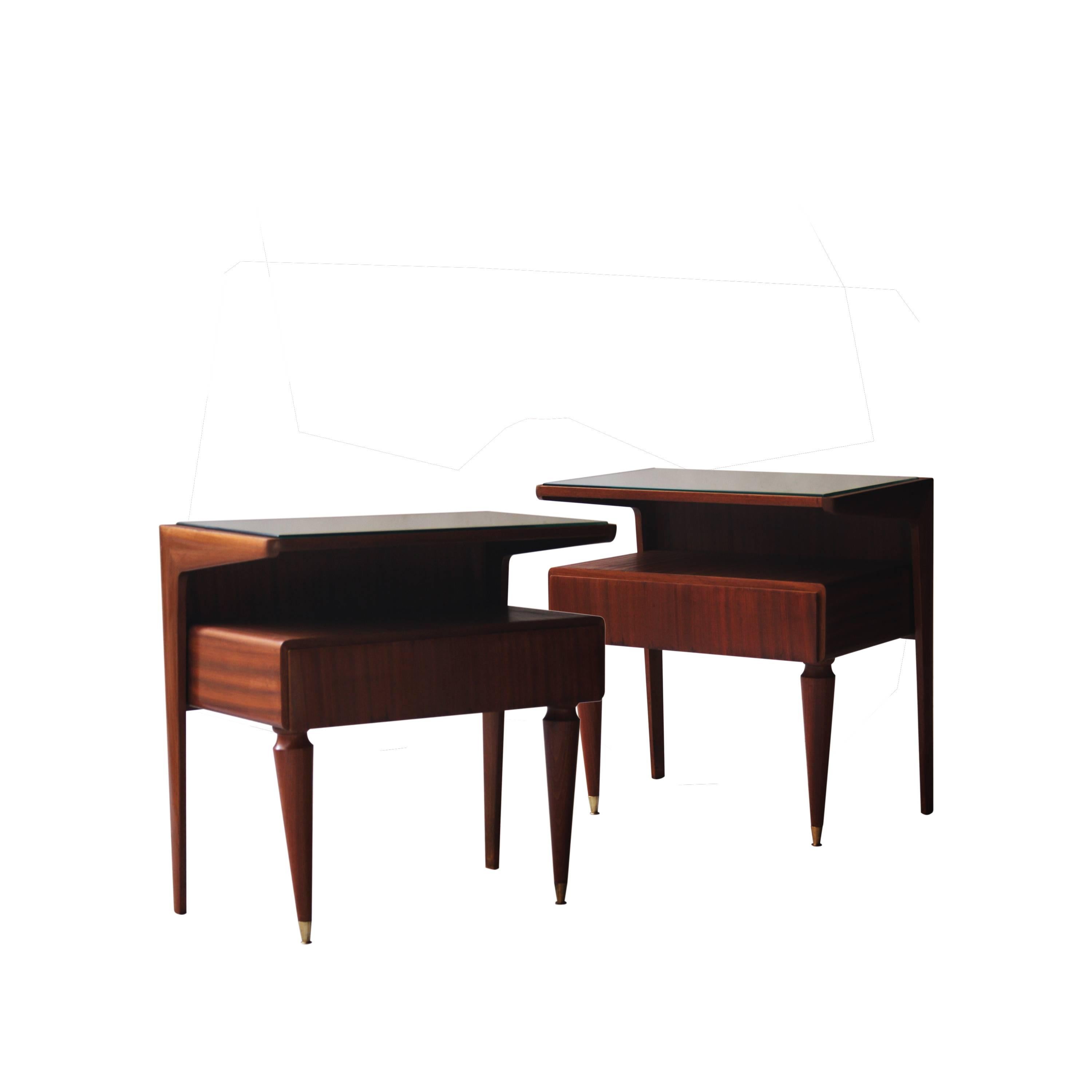 Pair of night tables made of rosewood, with conical leg finished in brass detail. With drawer and mirror glass top.