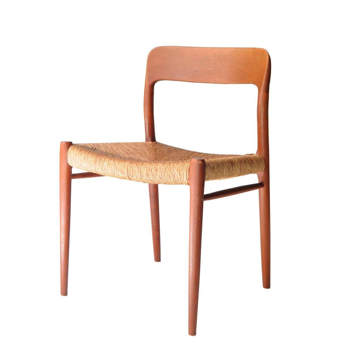 Set of four chairs designed by N.O. Møller with structure made of teak and cattail seat.