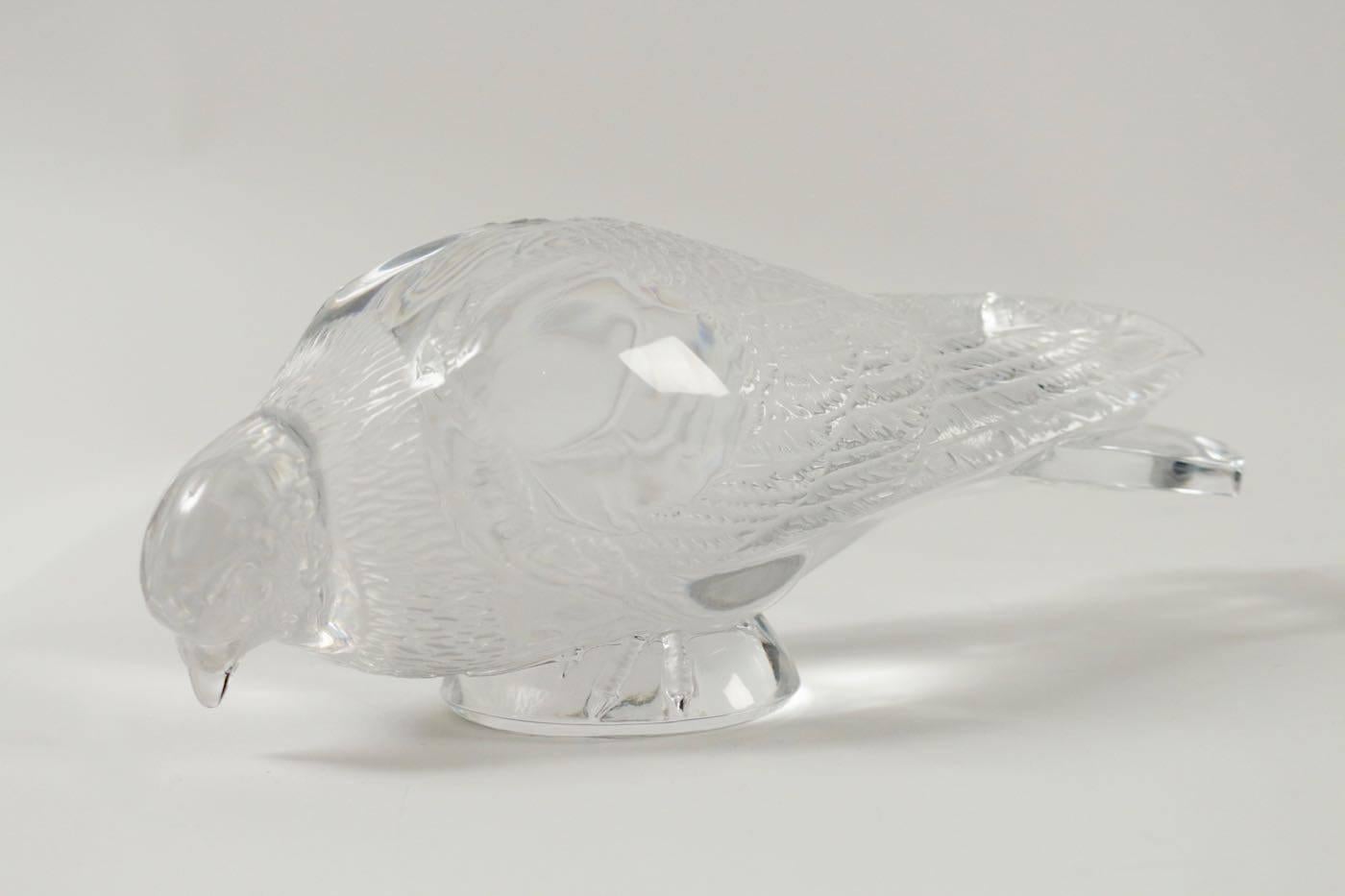 Lalique pigeon vervier decorative motif
clear and frosted crystal depiction of a pigeon with its beak down and body parallel to the ground
model 1206 created in 1932,
circa 1960 signed.