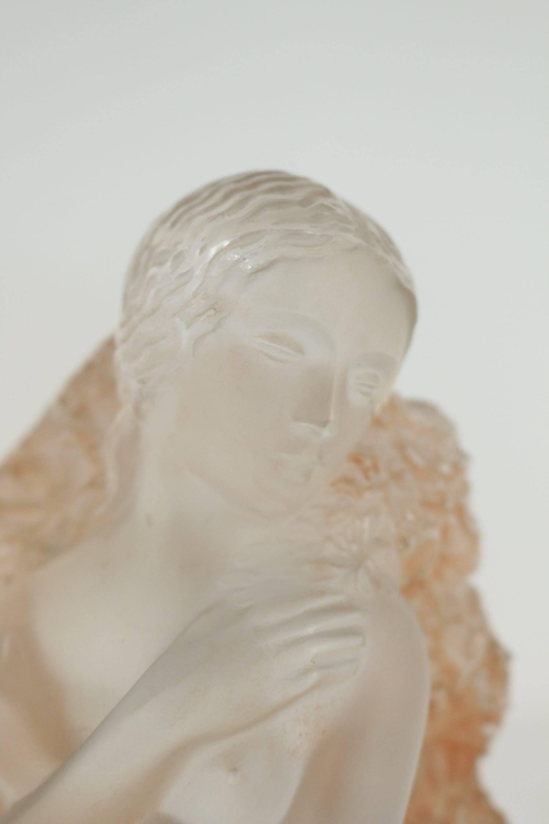 Lalique Statue Hiver: 
19.5 cm tall glass kneeling or seated female with arms crossed and covered in mistletoe with sepia patination R. Lalique Statue representing winter in the series of the four seasons. 
Model: 842bis, circa 1939.
Lalique