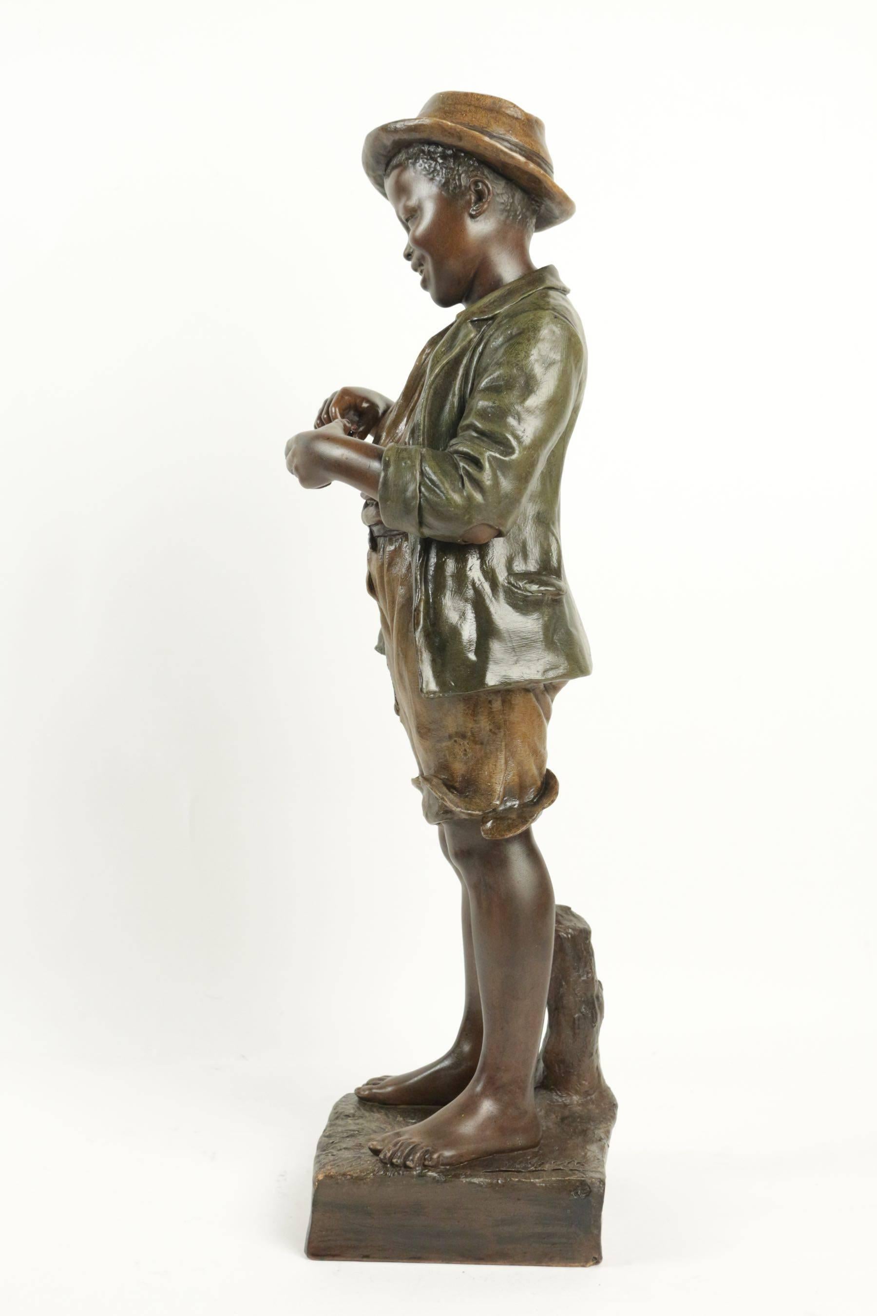 Terracotta  Goldsheider Small Black Man Using a Match