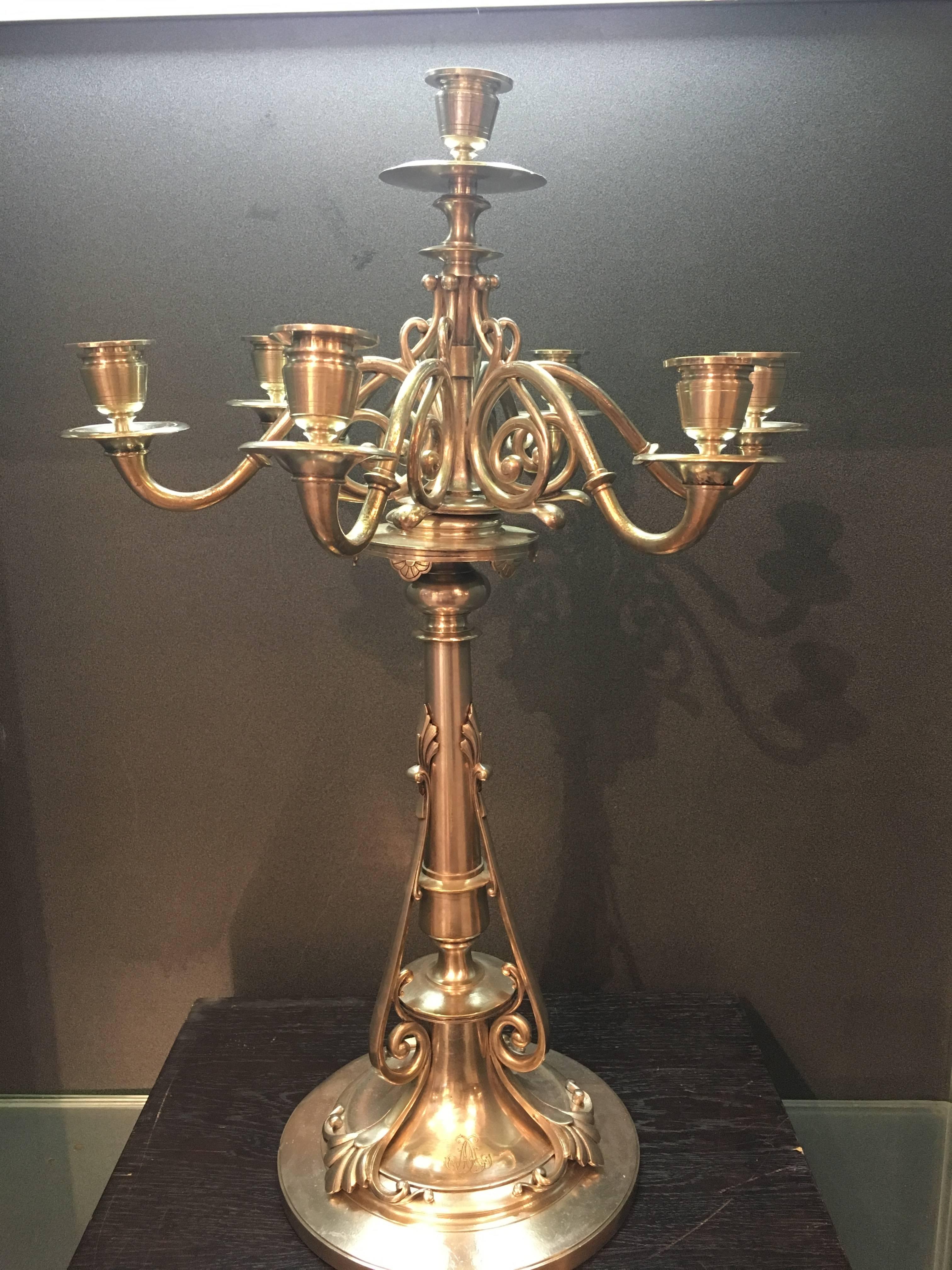 Large pair of silvered bronze candelabra by Christofle.
 The circular base is decorated with rests on three rolled feet. The 