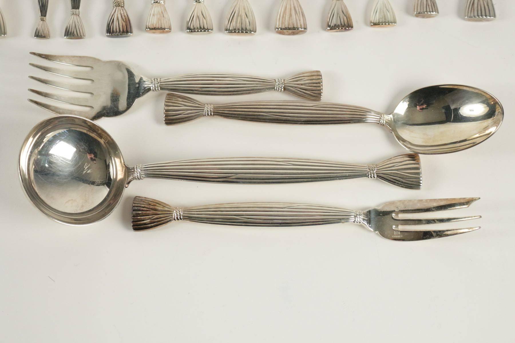 Silver plate important "Moisson" set including 12 knives(24 cm),forks(21cm), (19,5);  ten cheese or fruit knives (19.5cm), ten cake knives(19.5) cm, ten coffee or teaspoons(13.5 cm), six moka (10 cm) little spoons, one butter knife (16.5