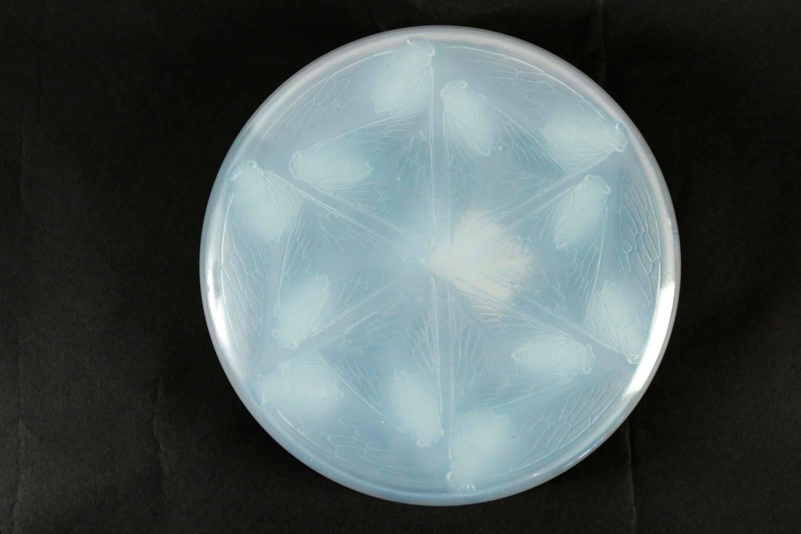 Rene Lalique 'Cigales' an opalescent box and cover, 
design 1921 
Molded pressed glass 
 Box 25.5cm diam
Opalescent glass two part beetle covered lalique box
Marcilhac no. 44
Shipping us cost from 120 Euros