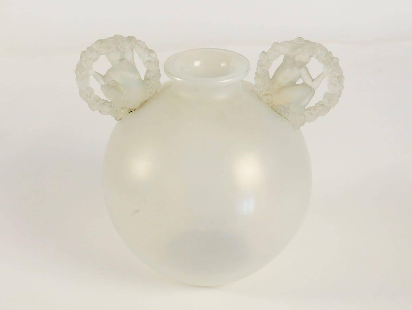 White opalescent glass container with an attached 