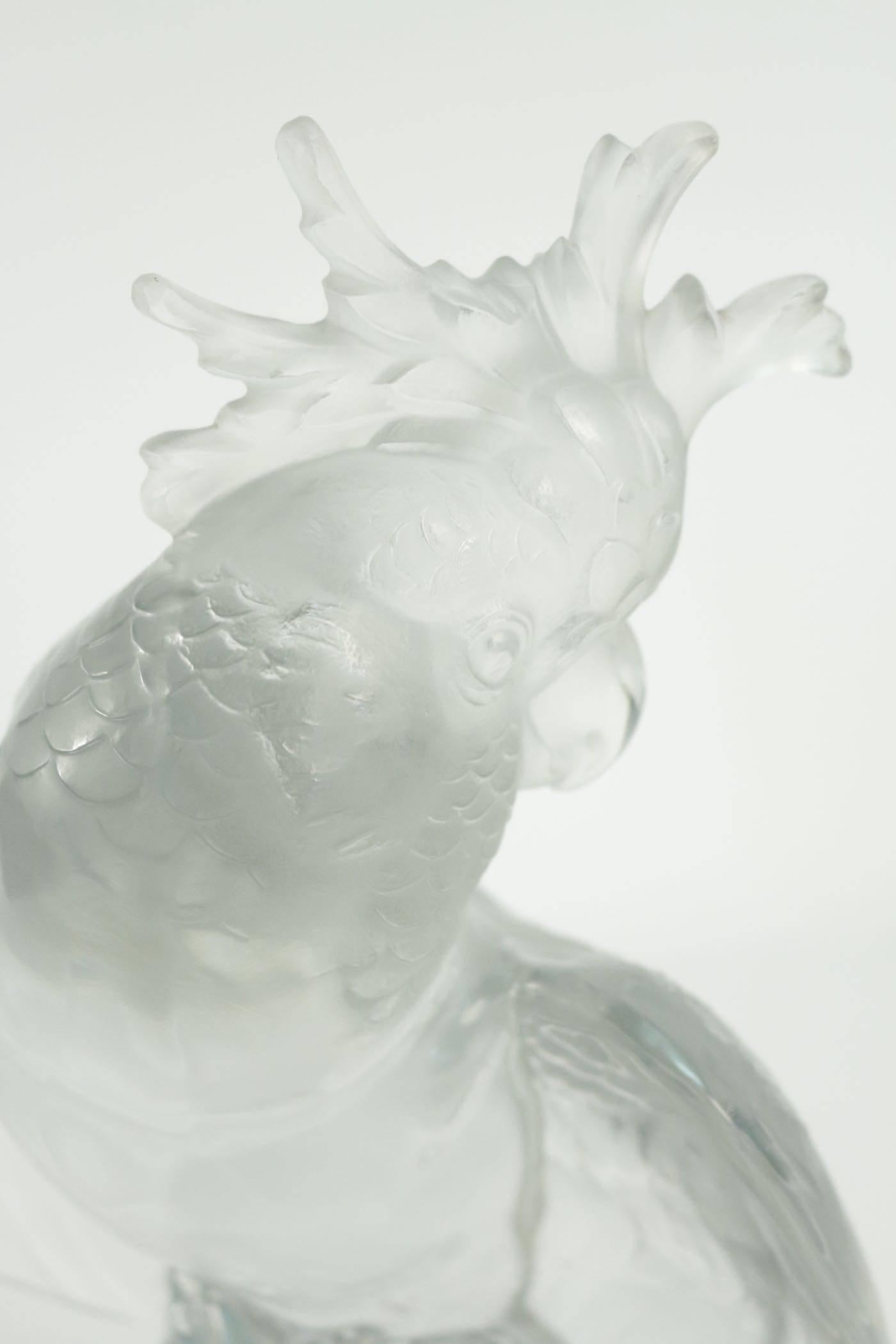 Pressed molded glass parrot
The wings spread out, resting on a thick conical base.

Lalique France Industrial print test on the base.
