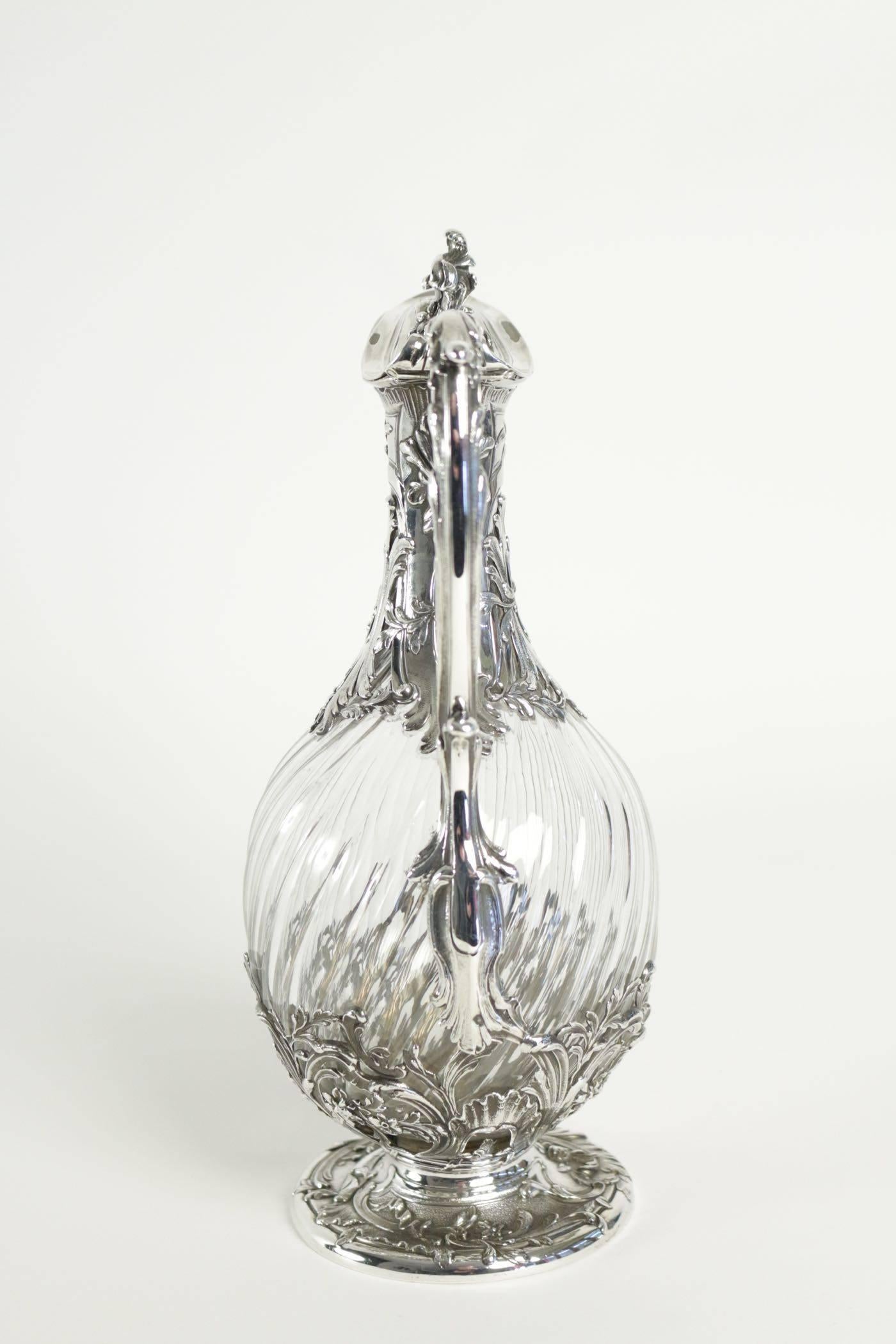 French sterling silver and cut-glass one claret jug.

 Rococo styling spiral cut body. Measure: weight 930 gr

Napoléon III silver and crystal wine decanter or Claret Jugantique French hallmarked sterling silver and cut glassornate with Rococo