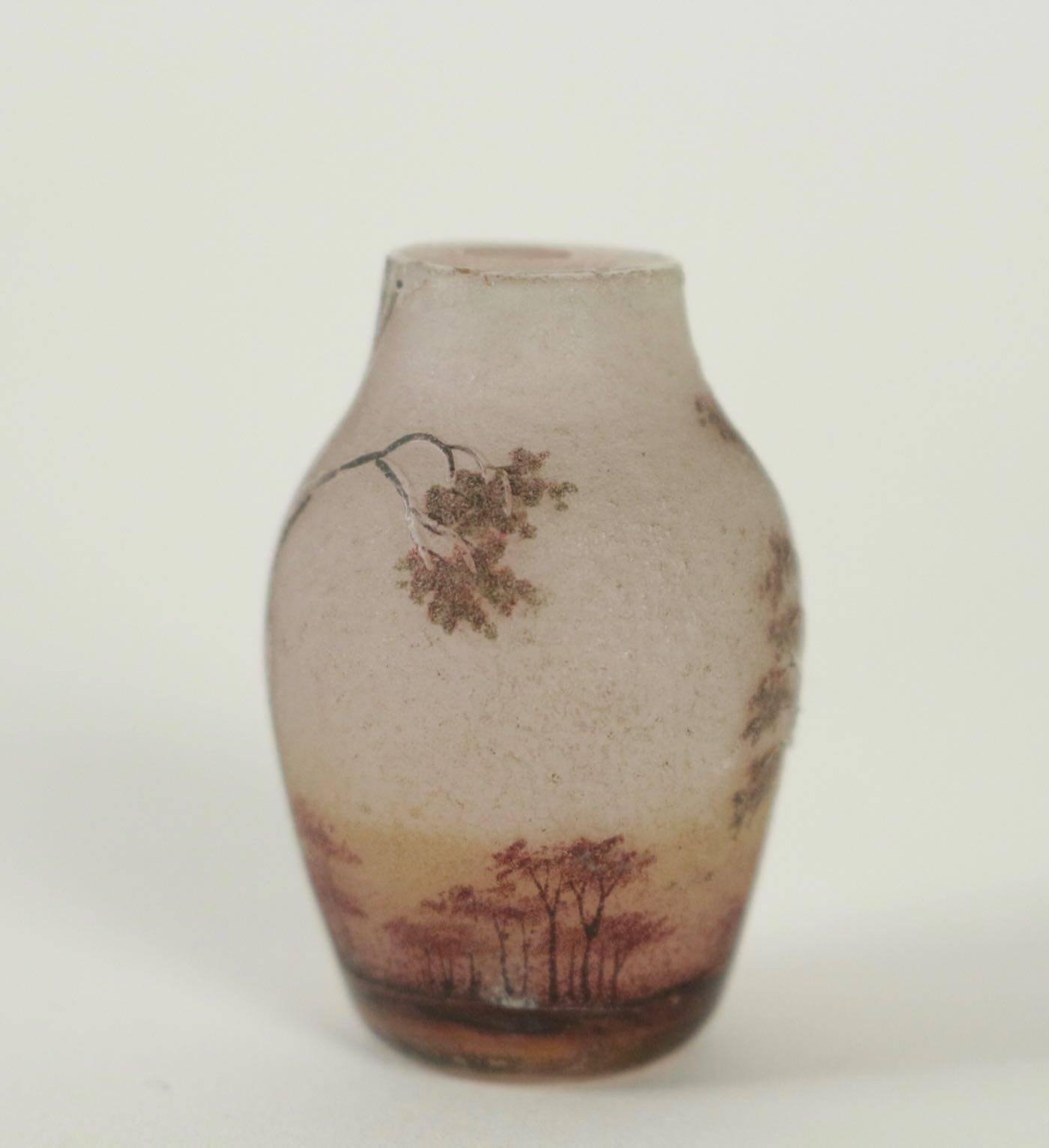 Daum acid etched and enameled miniature with the 'birch trees in autumn' design:
acid etched and enameled Daum landscape miniature vase with autumn Birch trees against a pink sky are both created with an inner layer of opaline pink glass with a