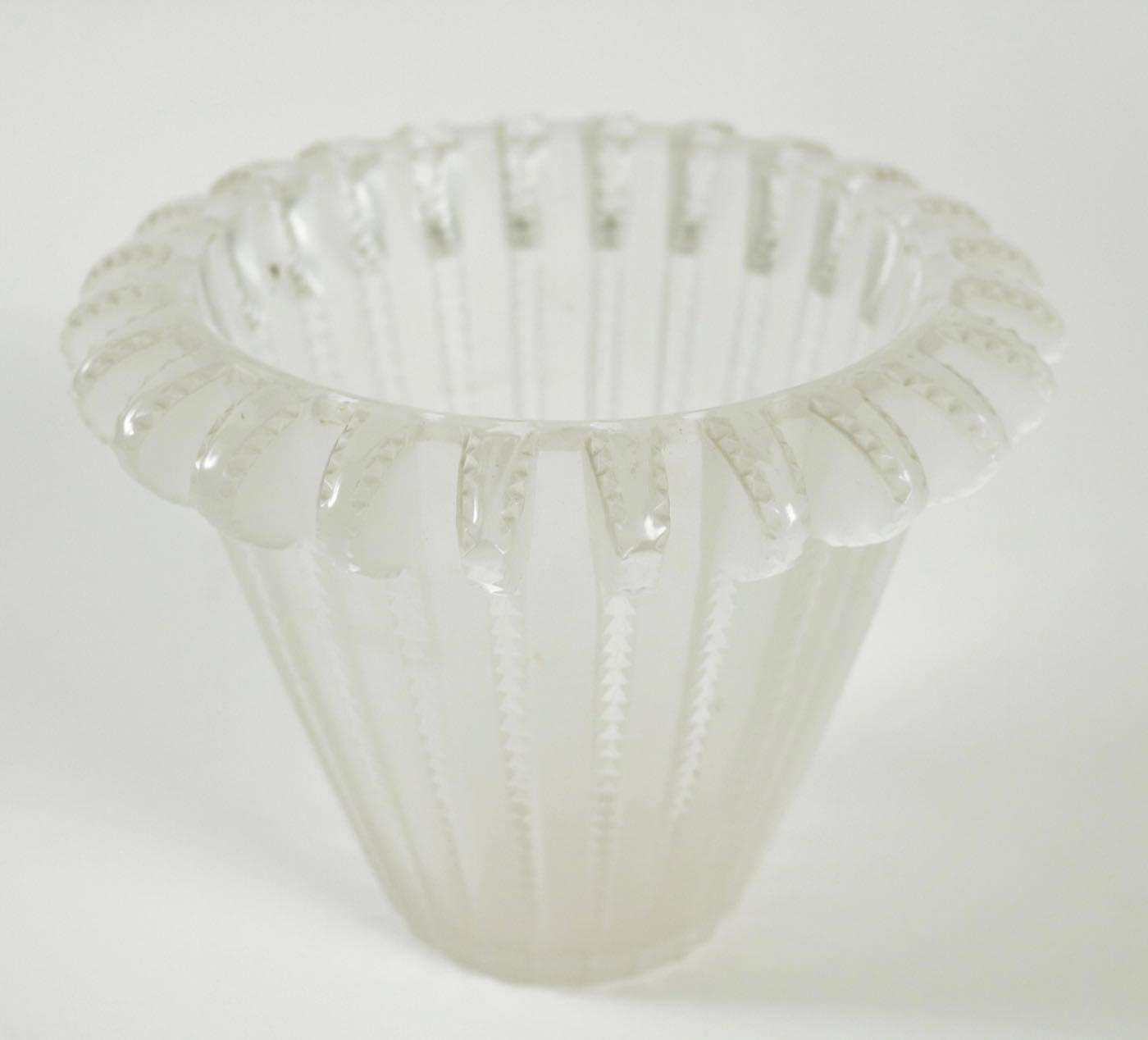 Royat, model created on April 28, 1936 vase molded glass pressed and, largely, satin. Signed R. Lalique France in relief under the base. Measure: Height 15.5 cm Bibliography: 