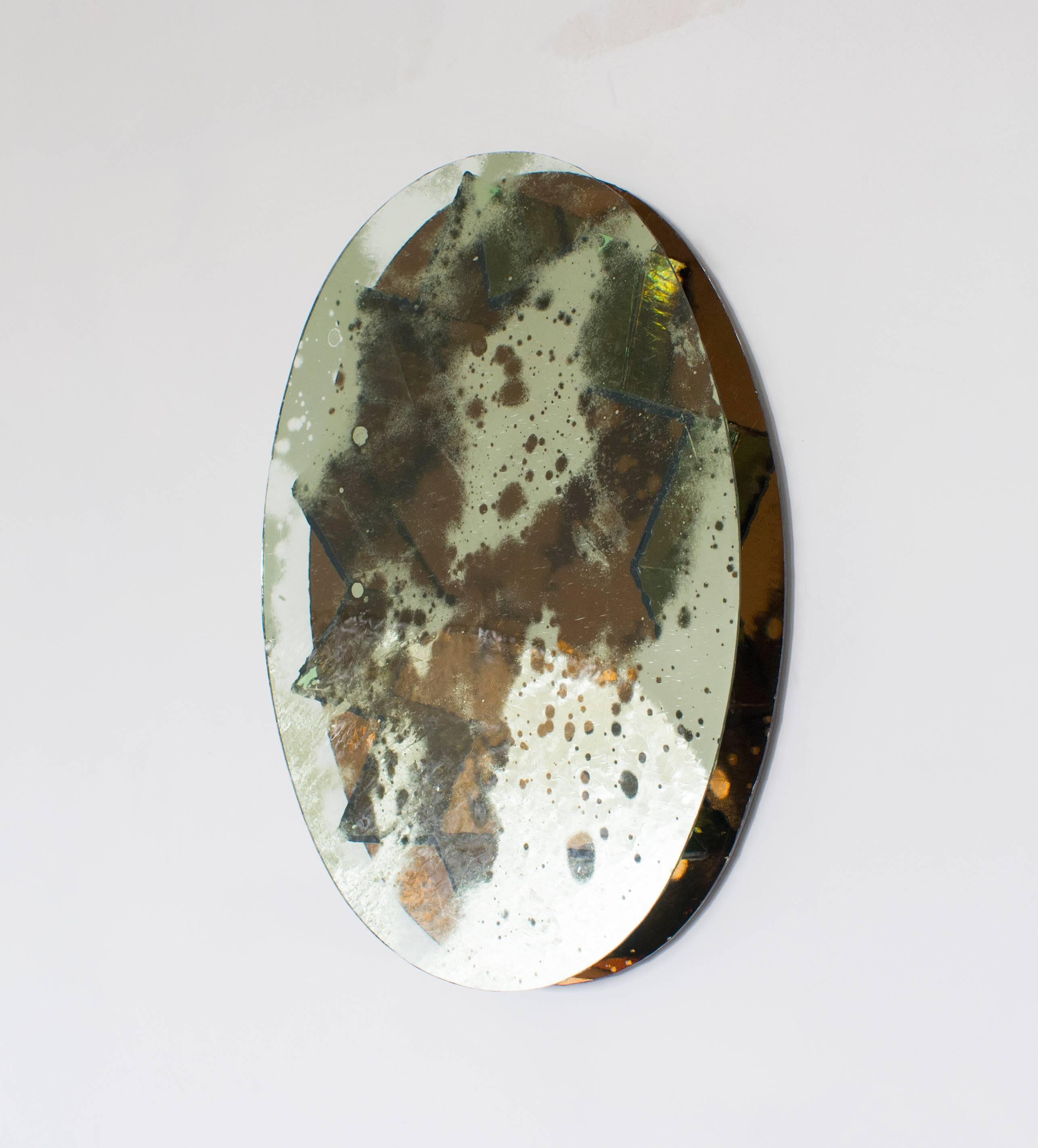 Patinated pale amber, amber and olivine mirror by English artist Sam Orlando Miller.
 