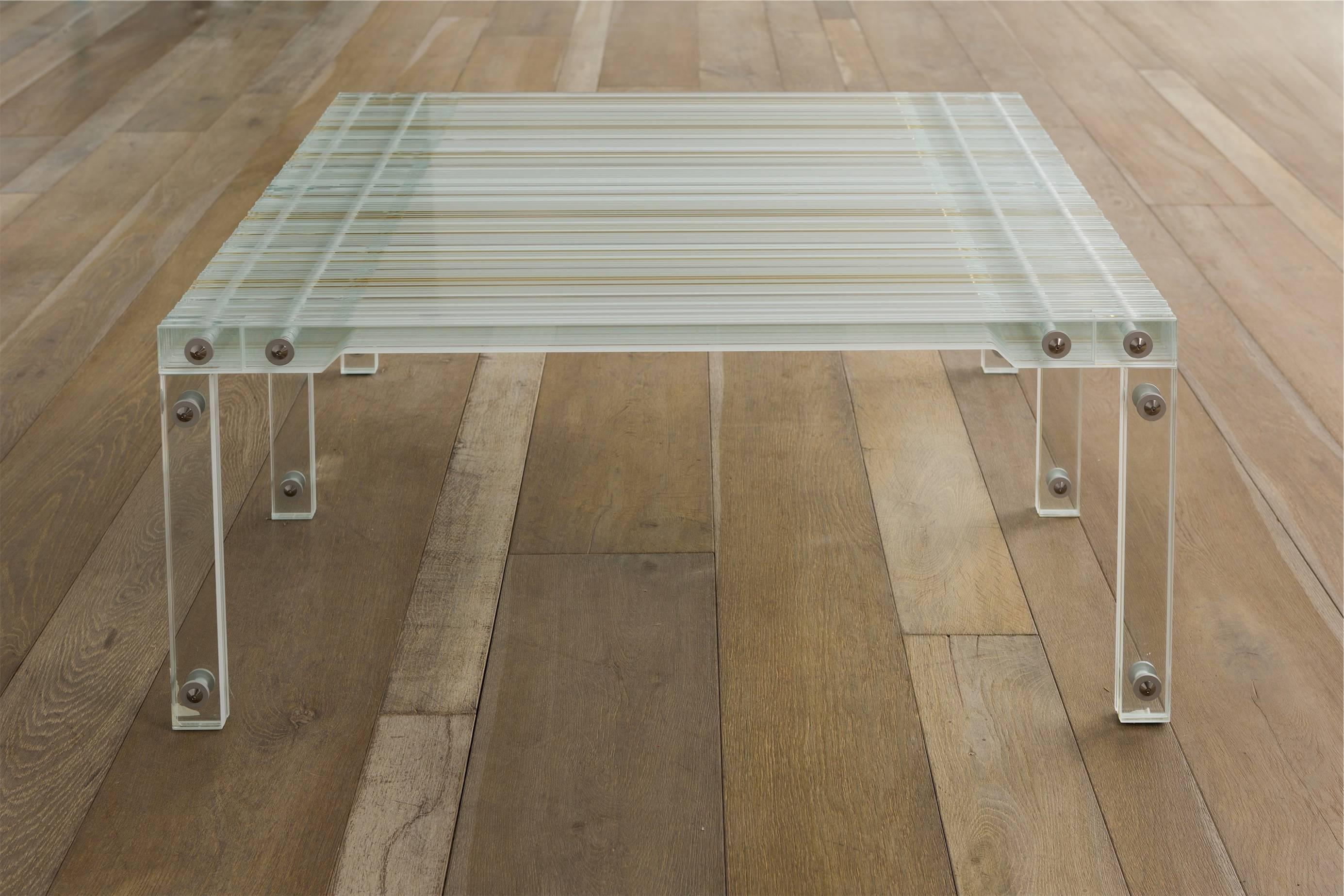 Coffee table made of strips of tempered glass by French designer Thomas Lemut.