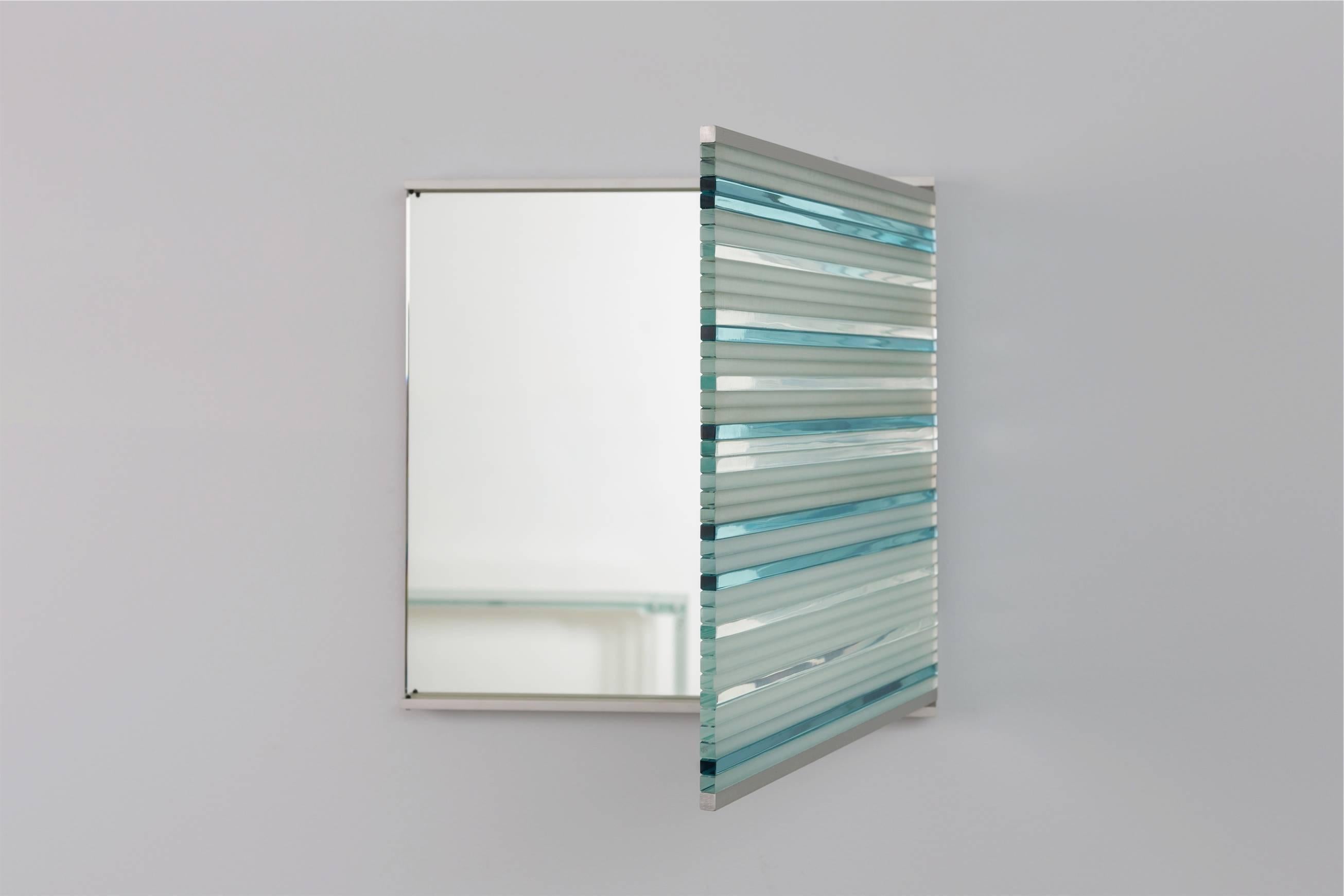 Mirror made of strips of tempered glass by French designer Thomas Lemut.