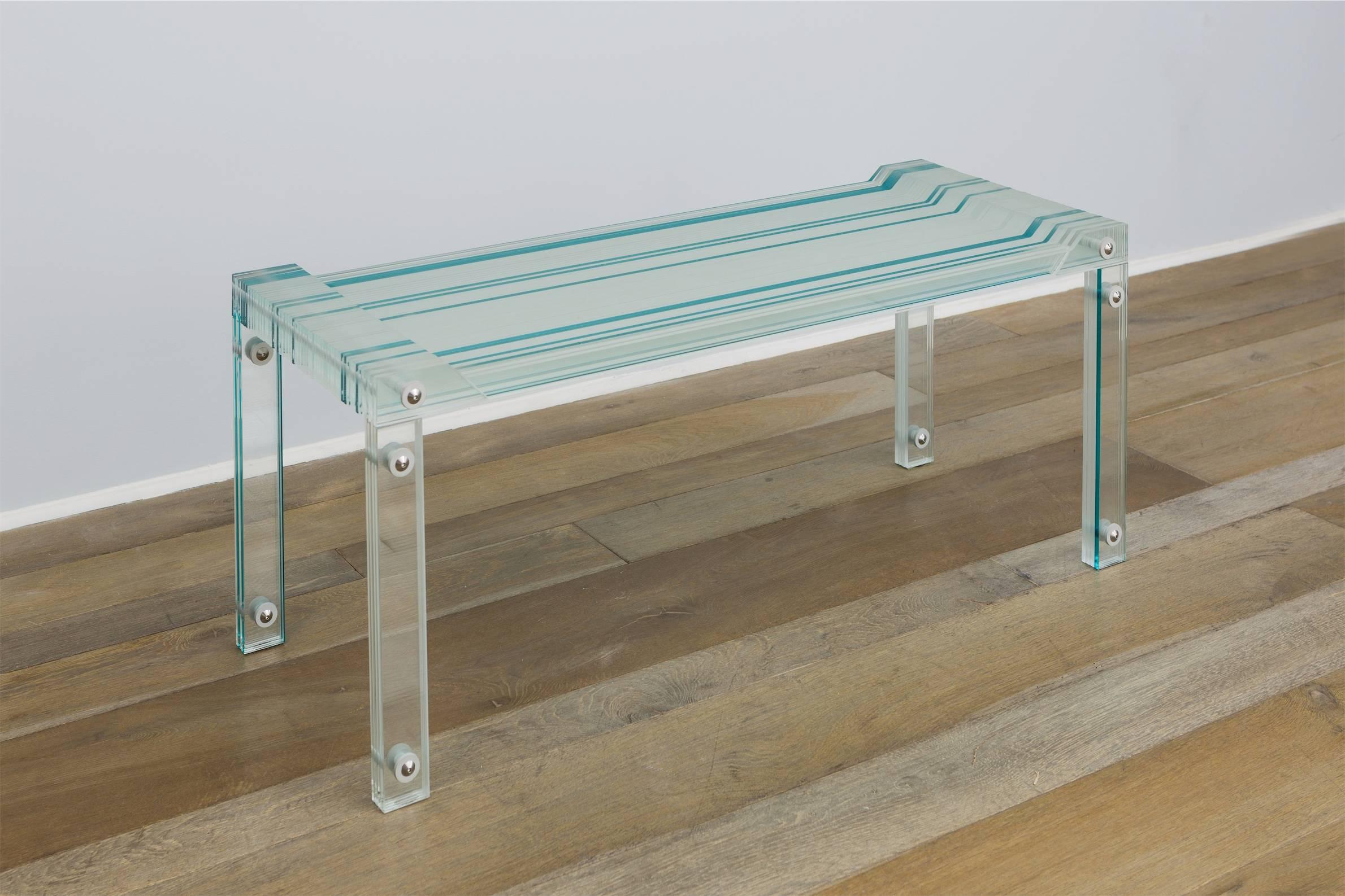 Bench made of strips of tempered glass by French designer Thomas Lemut.