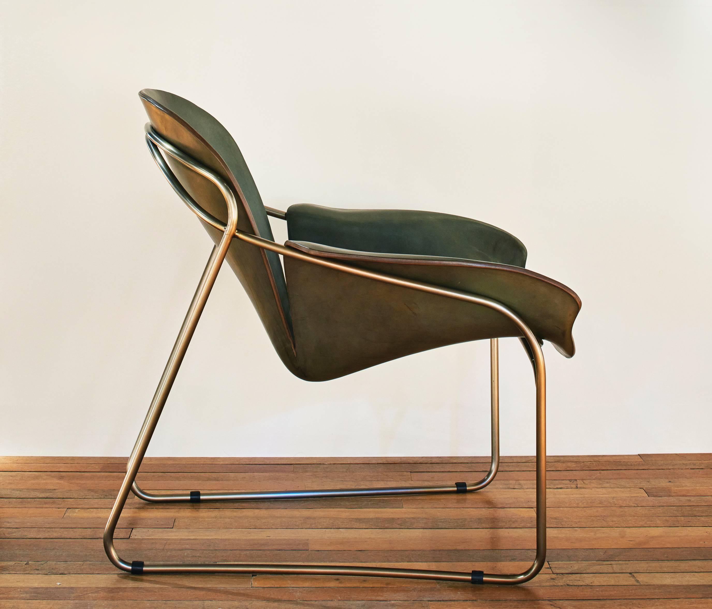 Leather chair with bronze-plated steel frame made by British designer Alex Hull. 


