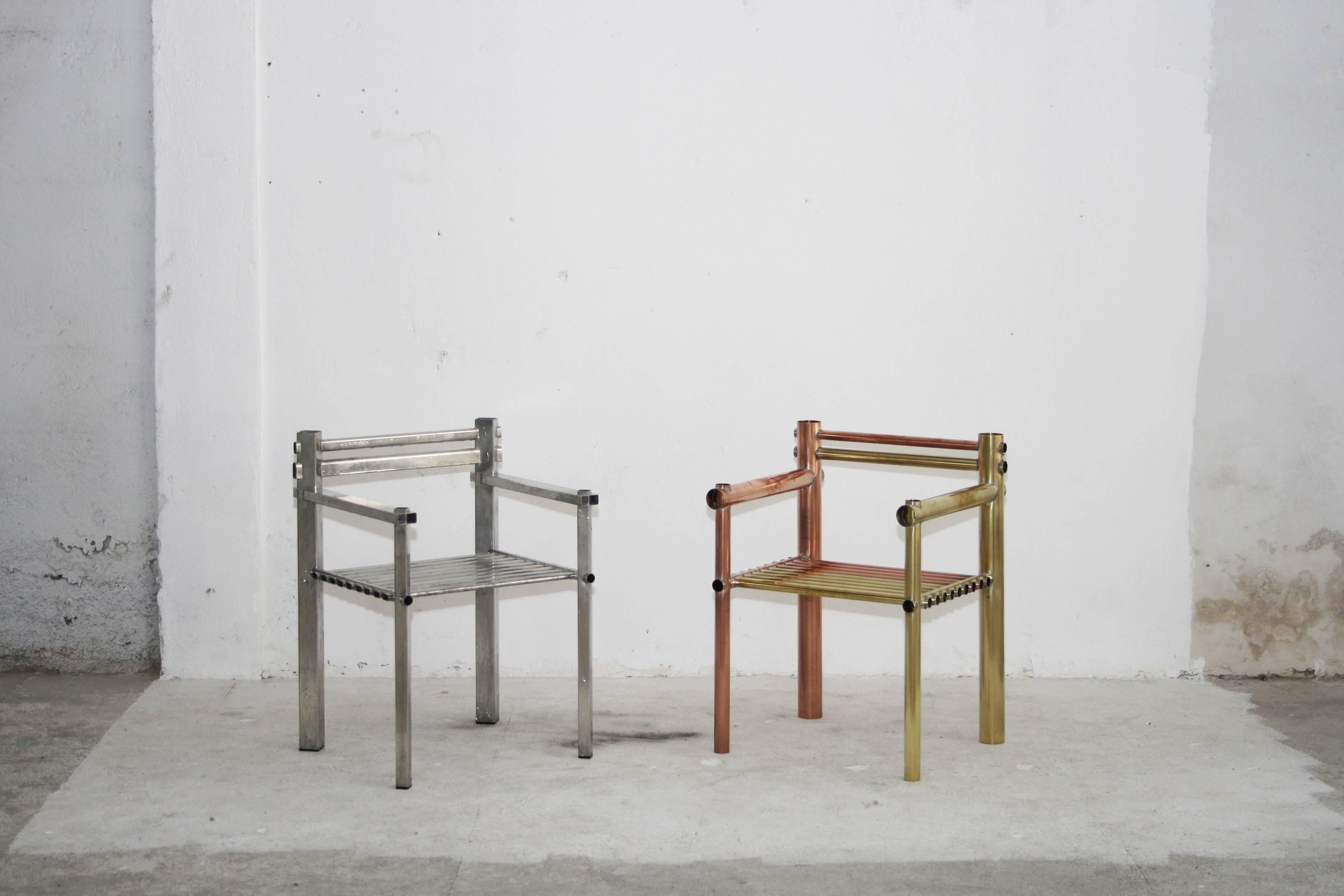 Metalwar chairs by English designer Max Lamb.

Approximate: H 57 / W 58 / D 52 cm - H 29.5" / W 22.8" / D 20.4".

Four chairs currently available:
Copper and brass.
Copper. 
Brass. 
Steel.
 