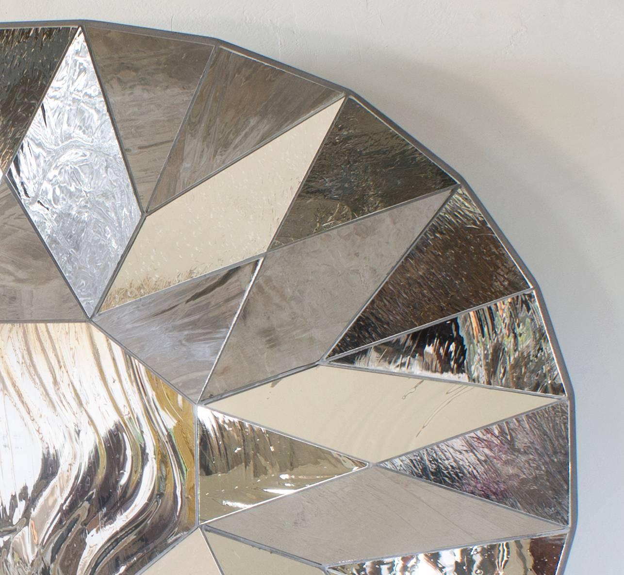 Striated silver mirror by Sam Orlando Miller.