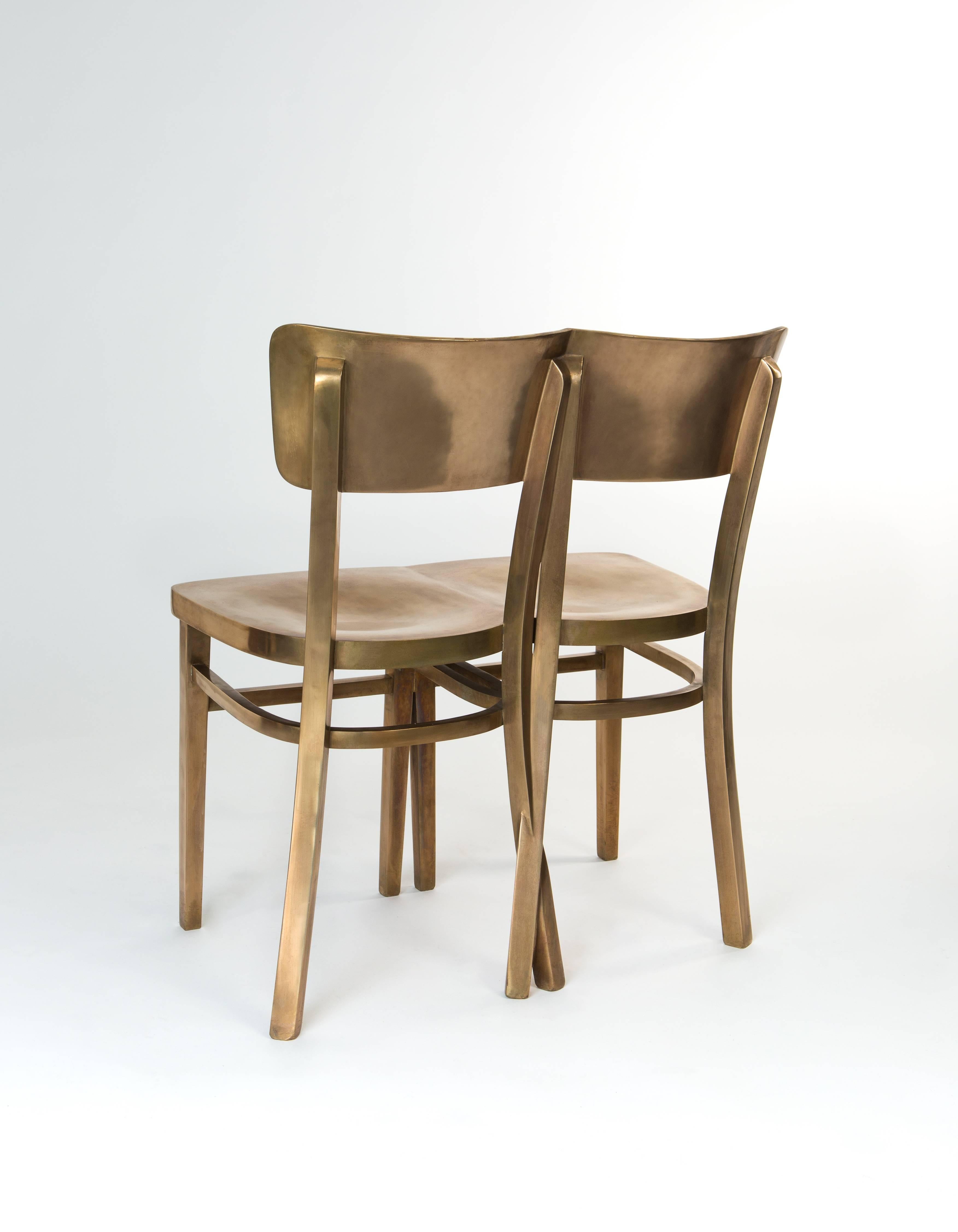 Chair made by Sofie Lachaert and Luc d'Hanis.

‘Crossed Leg Chair’ is a solid bronze chair fit for an intimate connection. The process takes two wooden chairs carved and attached side by side with their back legs intertwined before immersing them in