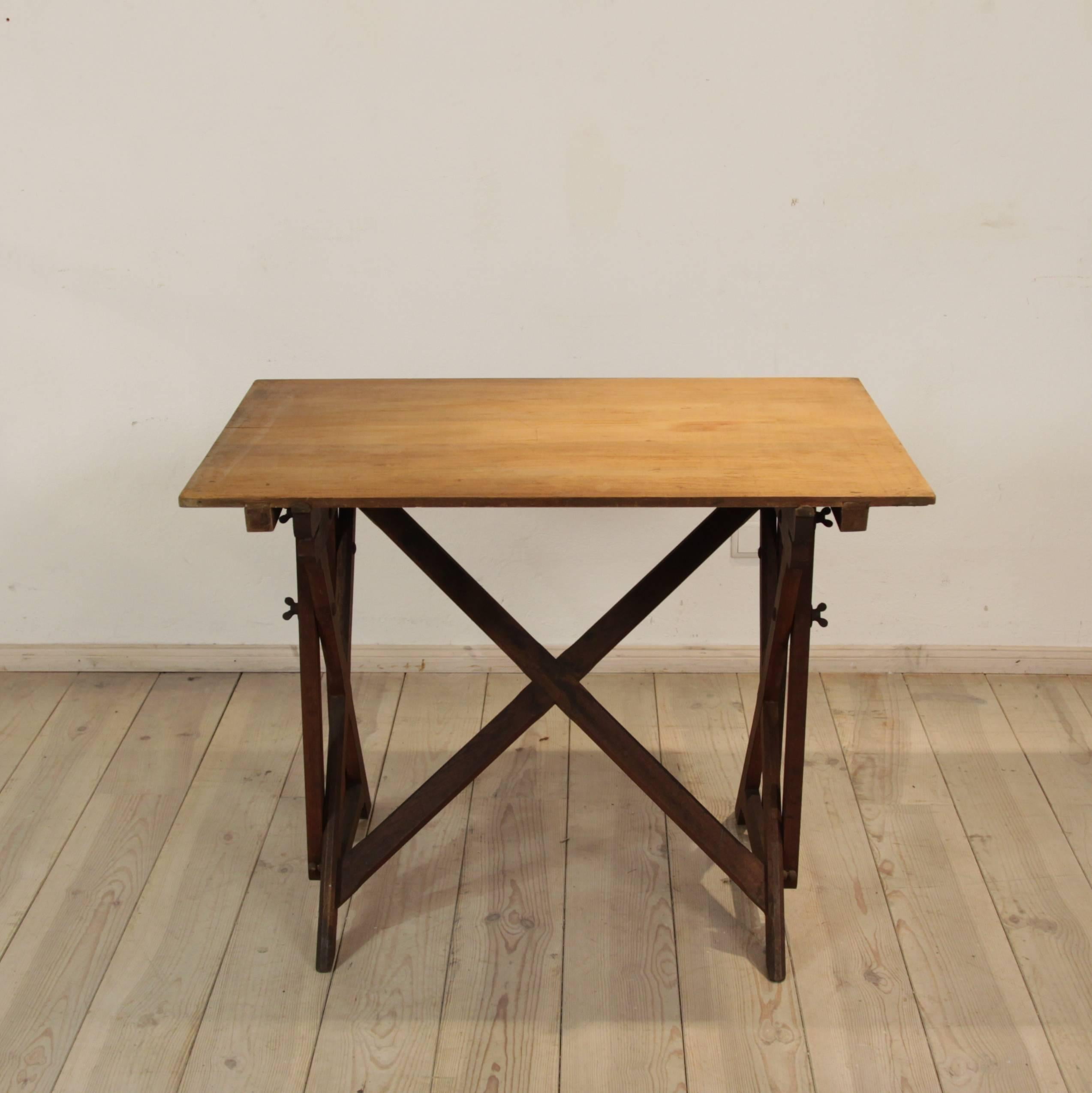 A German architects table, circa 1930 with an oak base and poplar-top by the company 