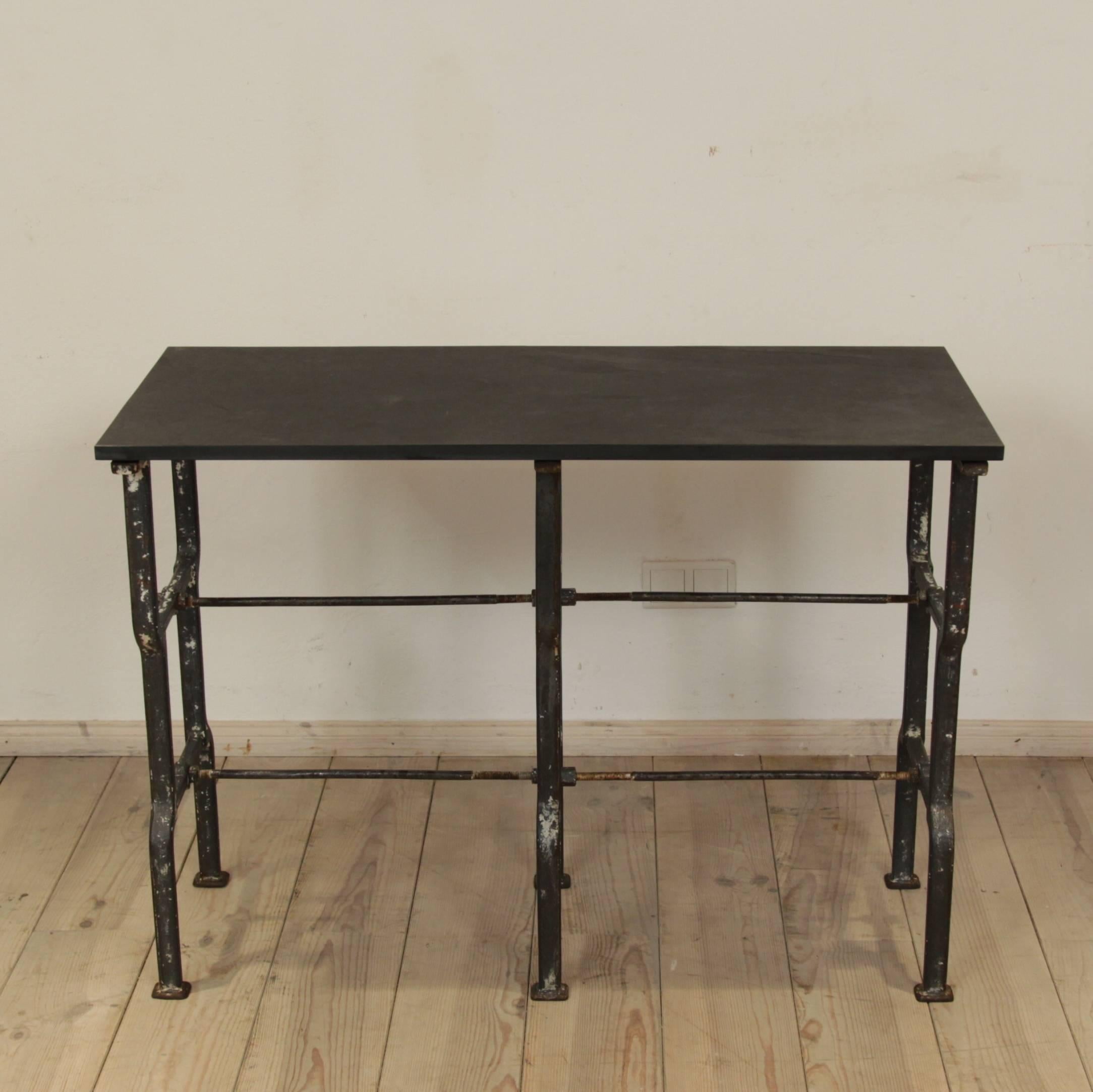 This former German Industrial table-base circa 1930 was converted into a elegant console table by adding a slate top.
