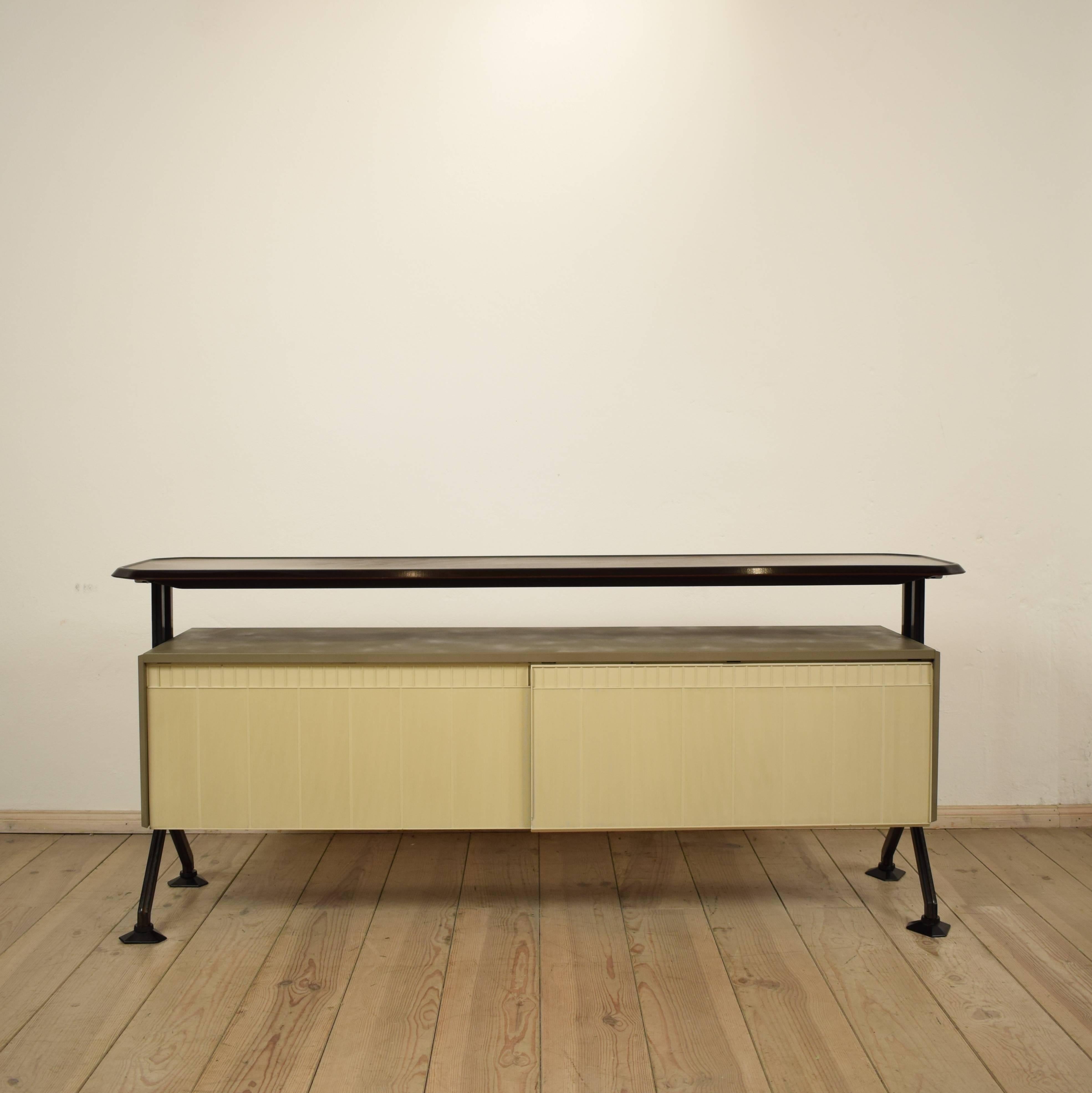 This vintage sideboard was designed in 1962 by BBPR. BBPR was an architectural partnership founded in Milan in 1932 and composed of Banfi, Belgiojoso, Peressutti and Rogers. Tragically Banfi died in a concentration camp during the second world war,