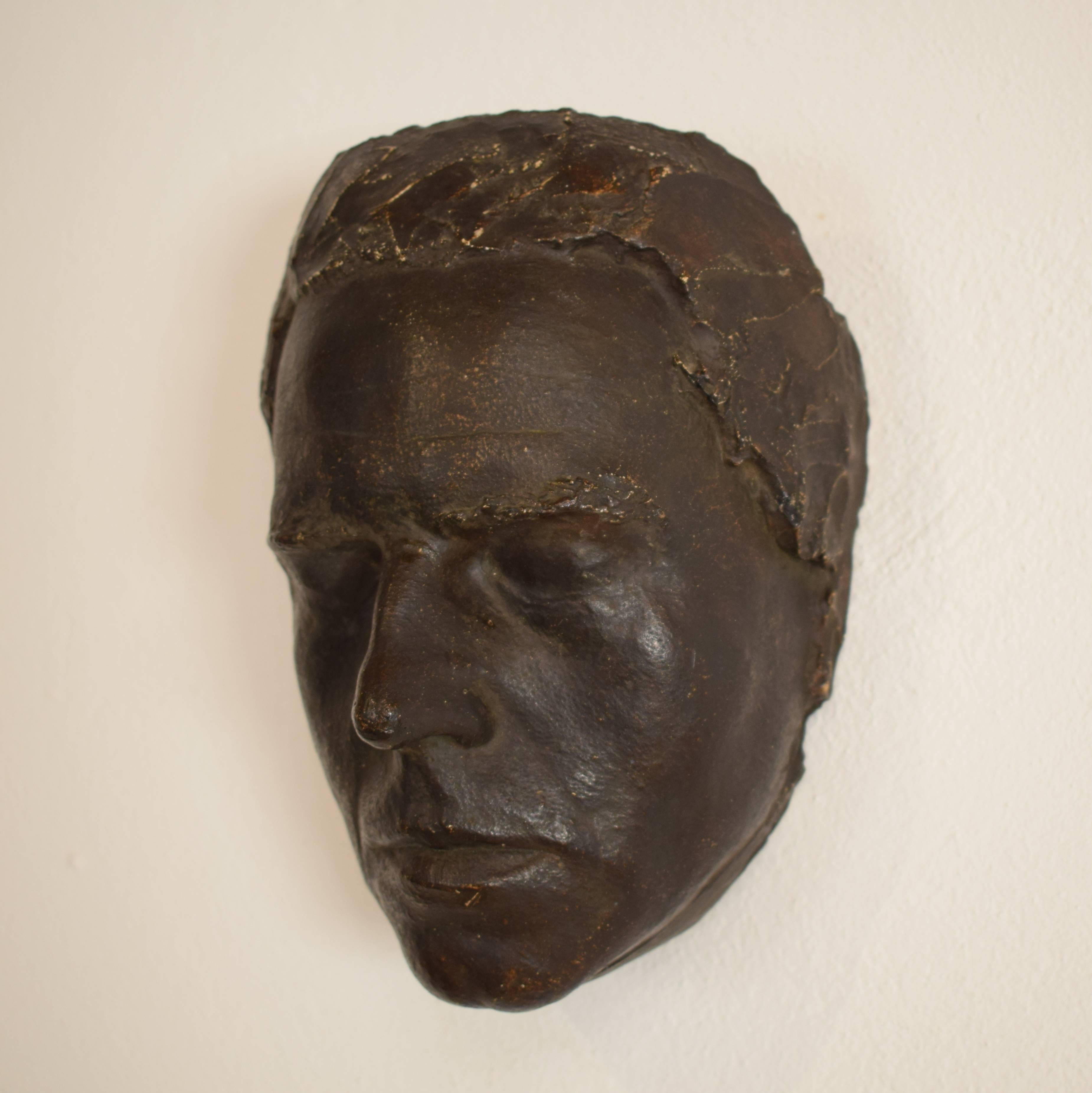 This early 20th century painted plaster mask by Karl Koch when he study at the academy of Art in Leipzig. He made it in 1910.