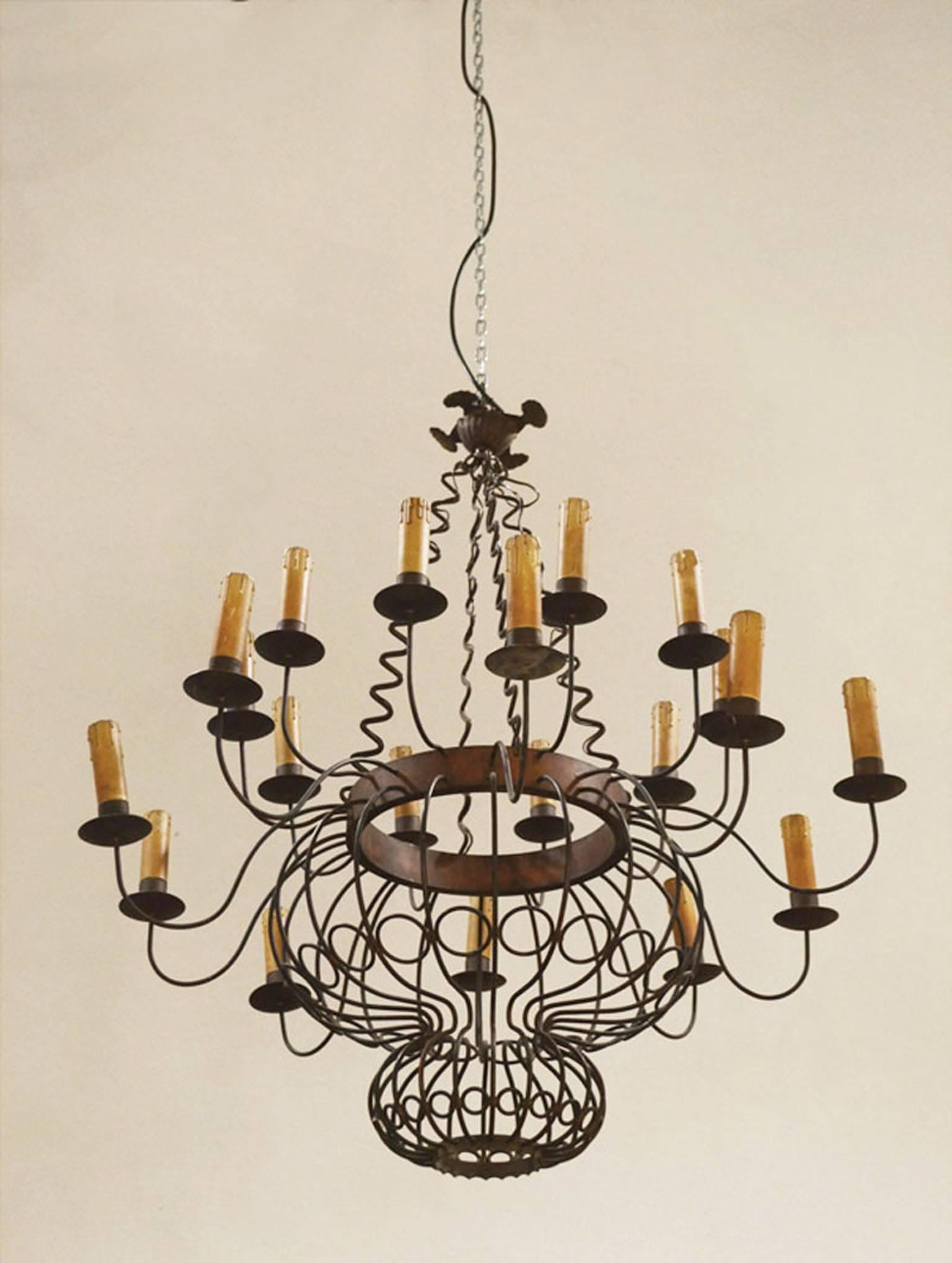 Great brass chandelier, Italian handmade production of the 1950s.
Central part ‘onion-shaped’ with 20 arms supporting lamps with candles lamp holders.
Wholly handmade.

 