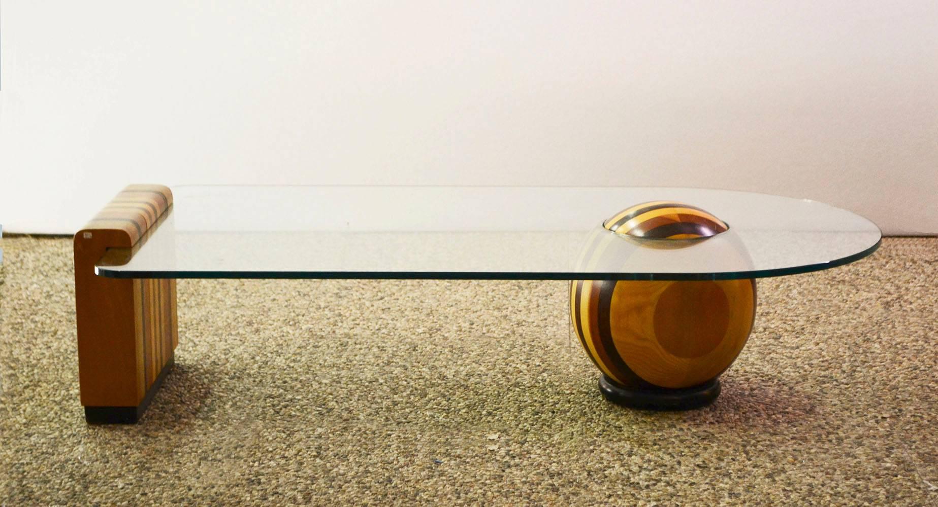 Coffee table of 1970s Italian production,with label 'Quadrie Italia'.
Bases in solid wood with different colors.
Top in shaped crystal.
 