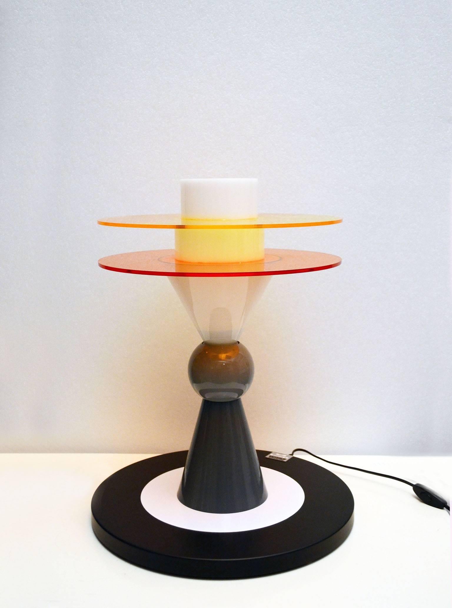 Ettore Sottsass 'Bay' table lamp for Memphis Milano, 1983.
In painted metal, glass and plexiglass.