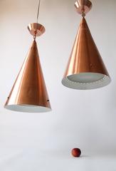 1950s Pair of Huge Pendant in Copper Anodized Aluminium with Glass Lens