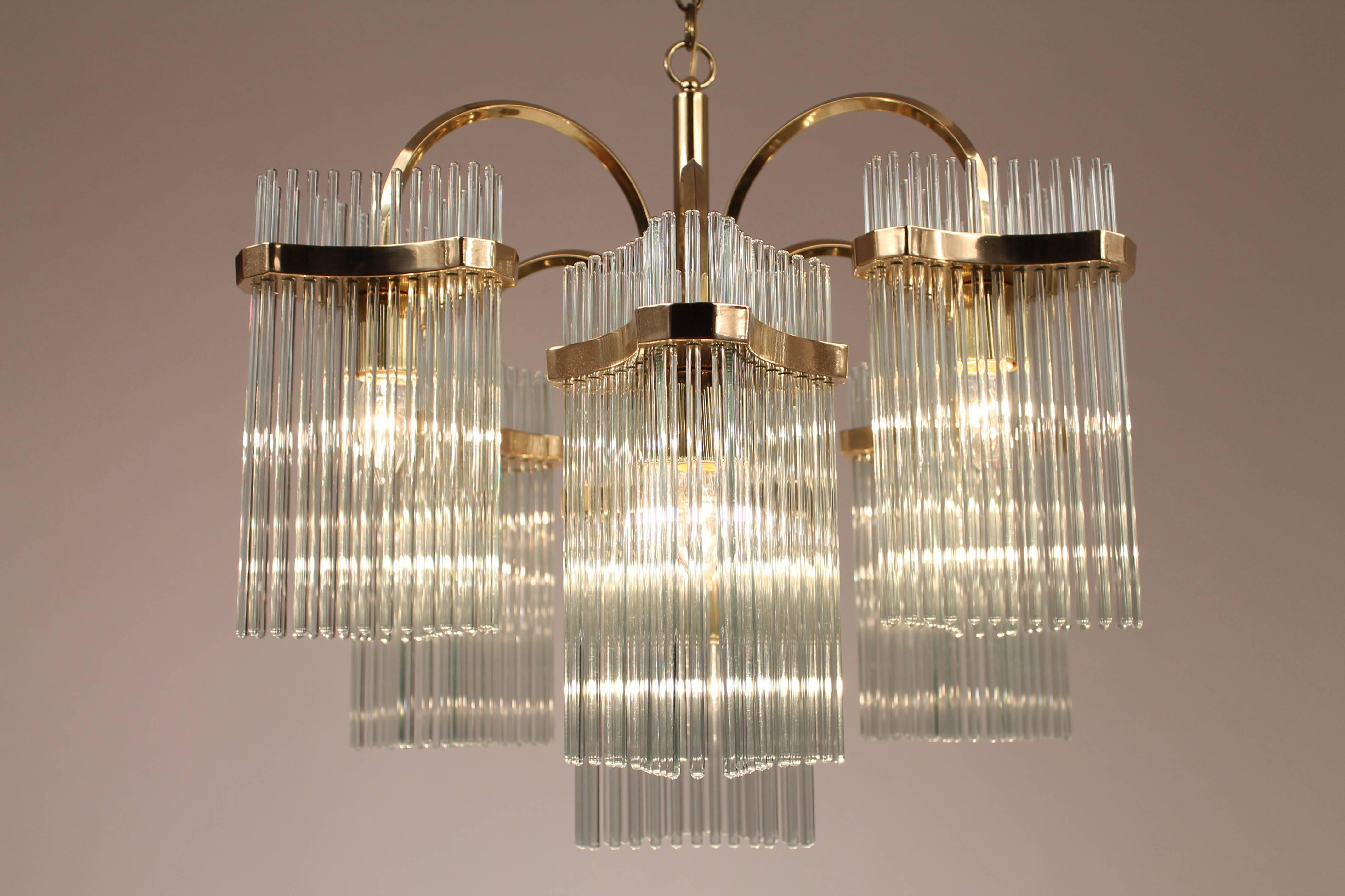 25 pounds of solid  brass and glass rods.

Extremely strudy construction. 

Chandelier is 25 inches at widest point by 22 inches high.

Come with matching canopy .

Socket are regular  north american  E26 size rated at 60 watts each .

We