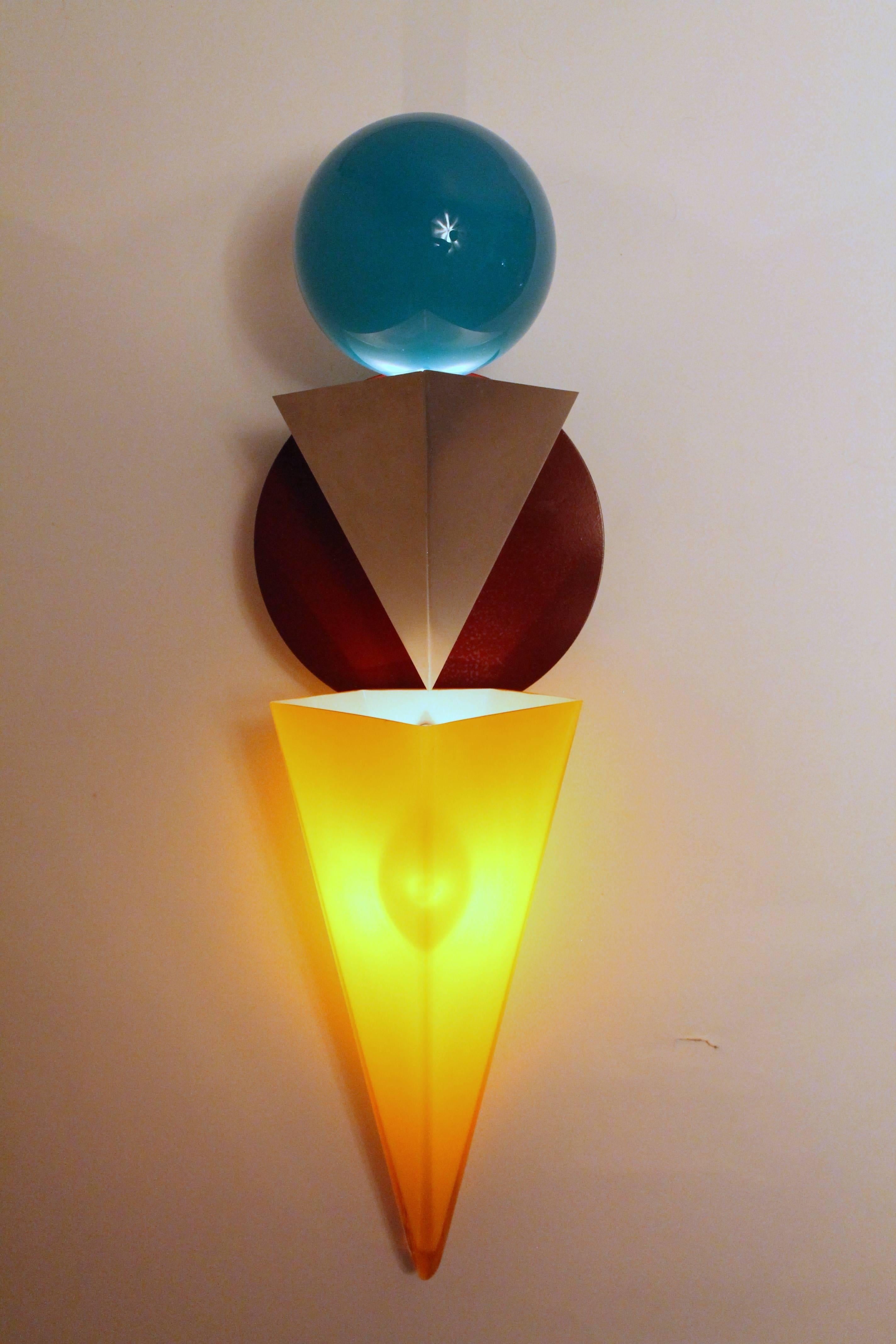 Rare sconce by Foscarini.

Stunning geometrical design with primary colored mouth blown glass.

Two halogen light bulbs.

Designed by Adam T. Tihani and Joseph Mancini.

Measures ; 25 inches high  by 7 inches wide.

One piece out of a set of three.