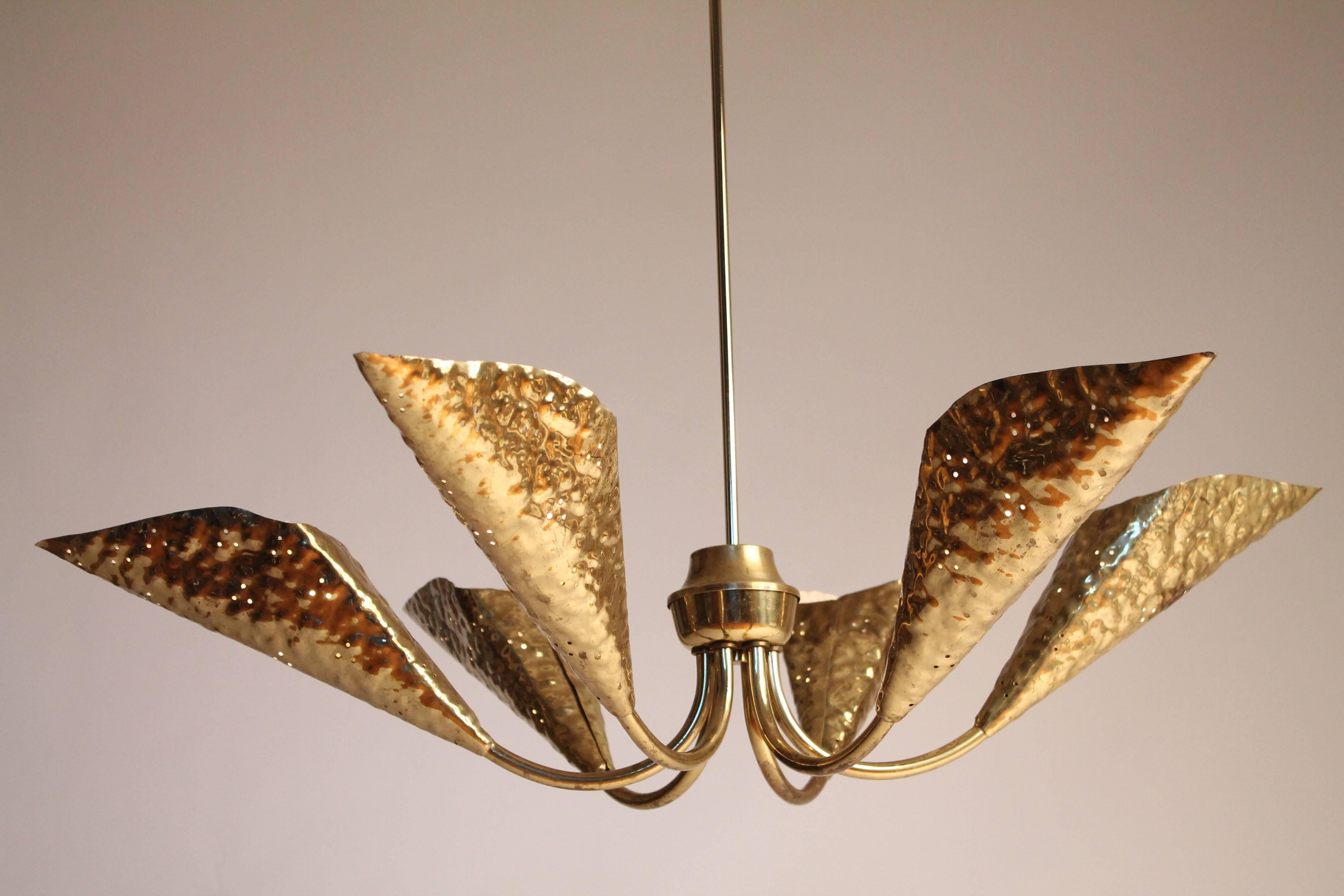 Gently pierced, masterfully hand-hammered sculptural brass leaf shaped shade chandelier. Enameled white inside.

Measure: 37 inches wide by 44 inches high.

Six regular E26 North American socket.

                  